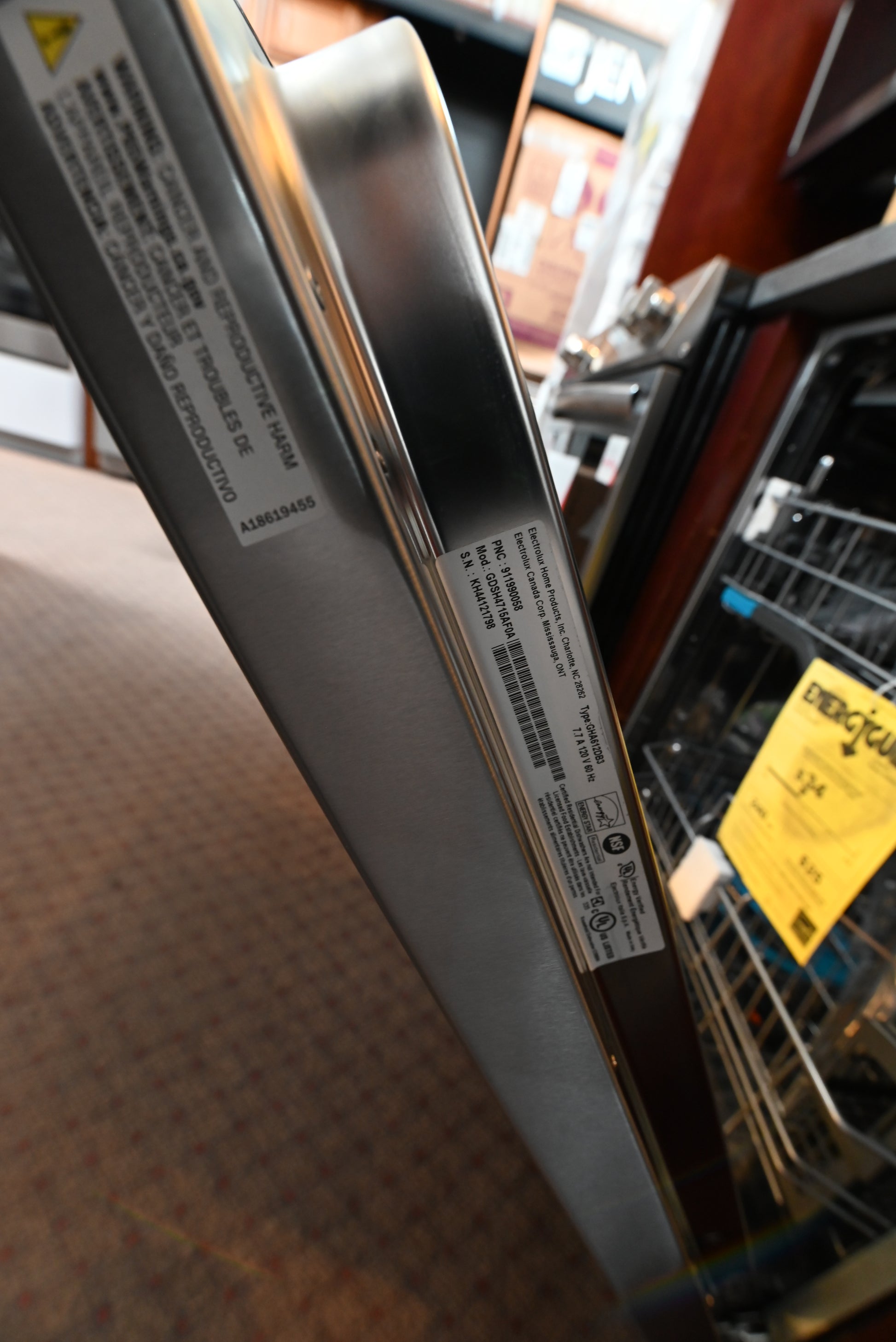 Frigidaire Gallery 24 inch dishwasher installed flush under light quartz kitchen countertops