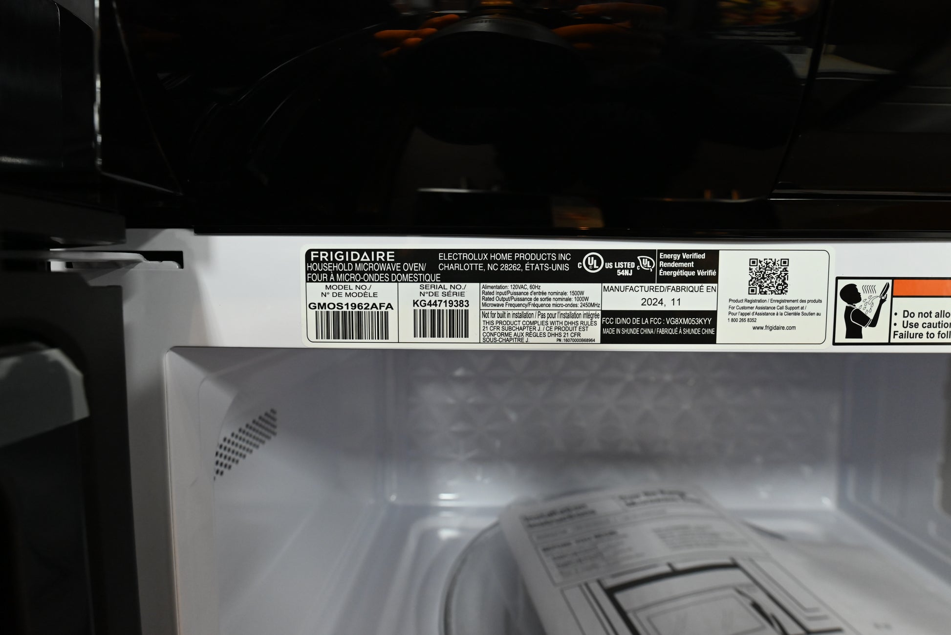 Frigidaire Gallery over the range microwave installed flush under upper cabinets above a cooktop