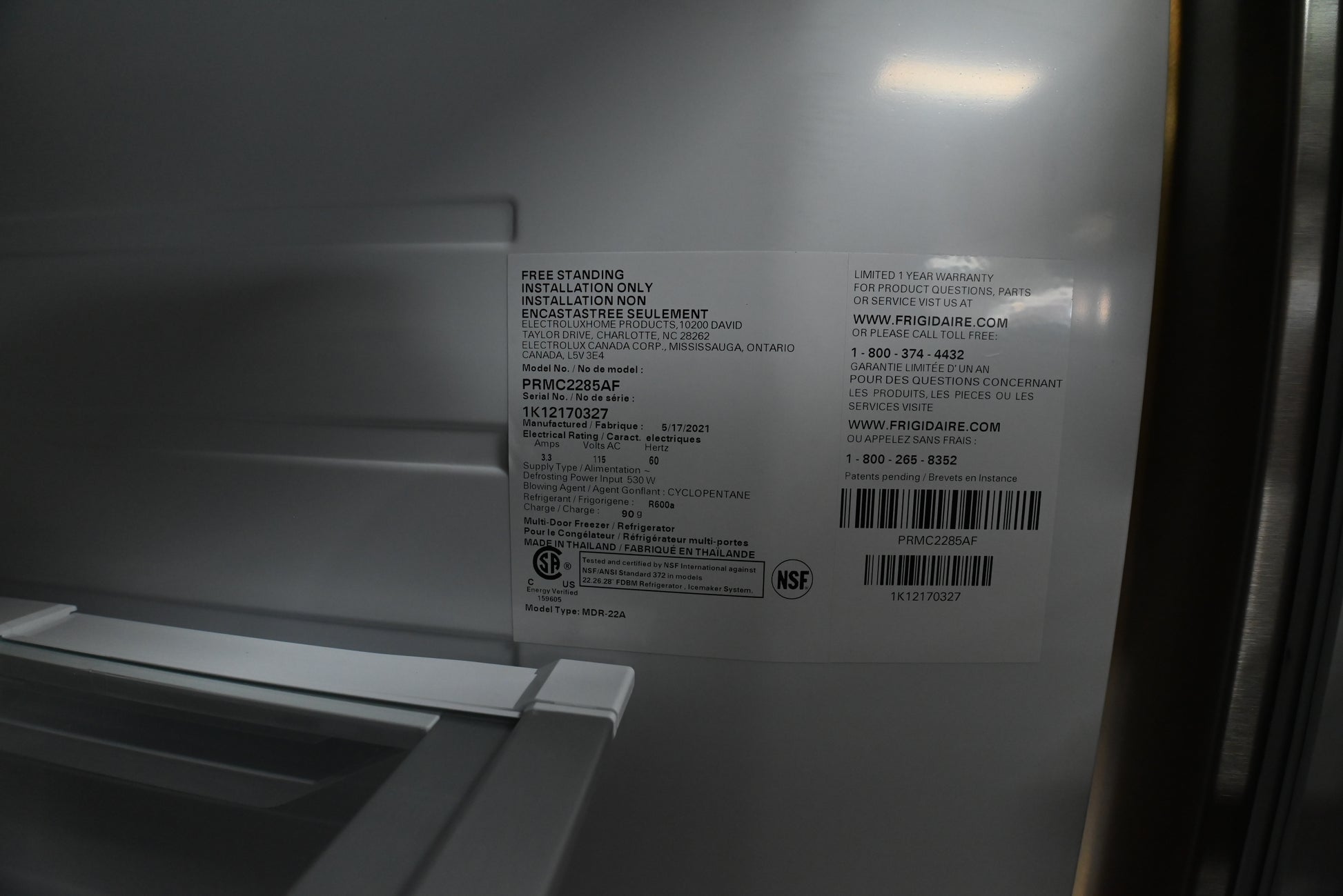 Frigidaire Pro 36 inch stainless steel refrigerator showing tall water ice dispenser pocket close up