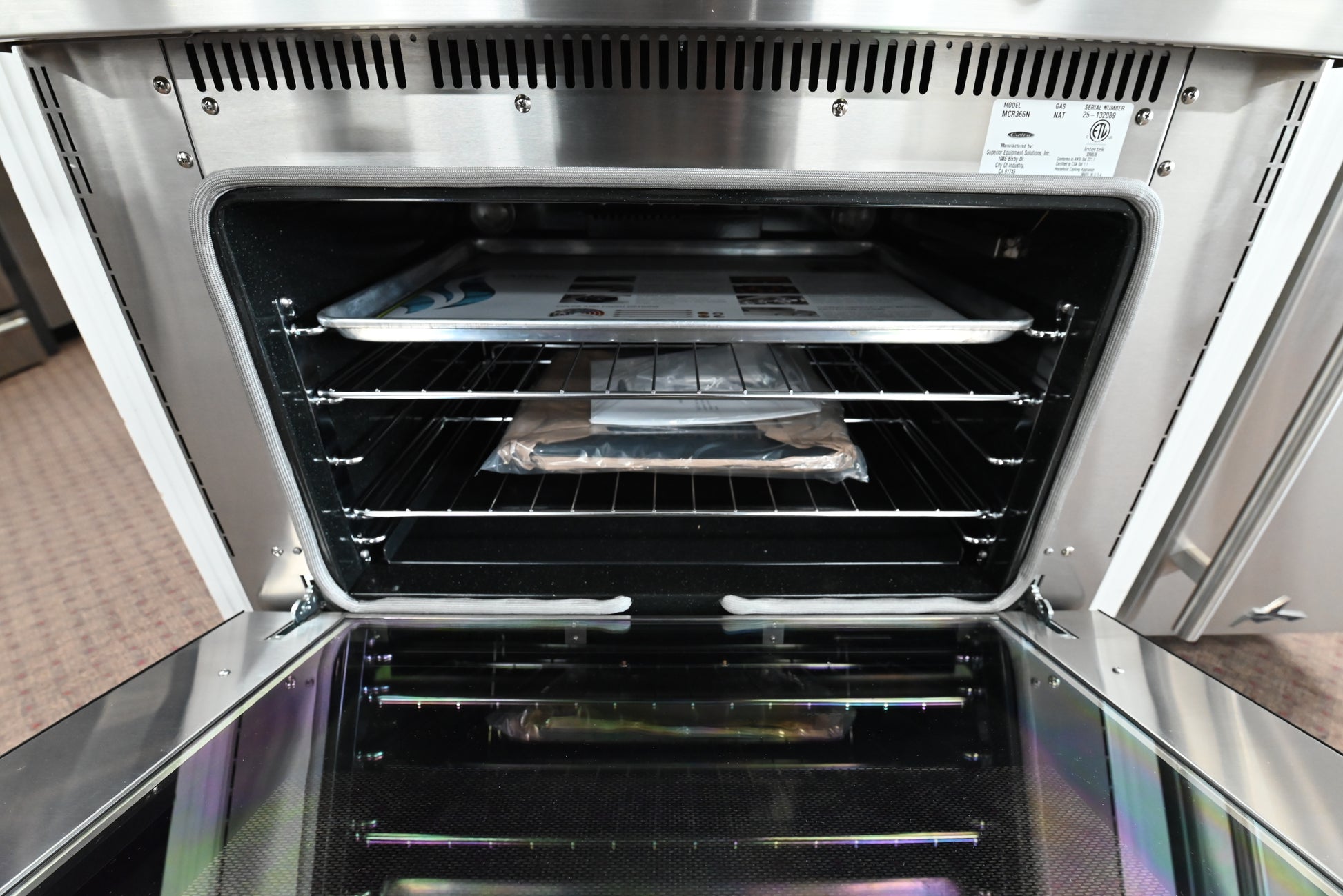 Close up of Capital MCR366N burner grates and die-cast chrome control knob