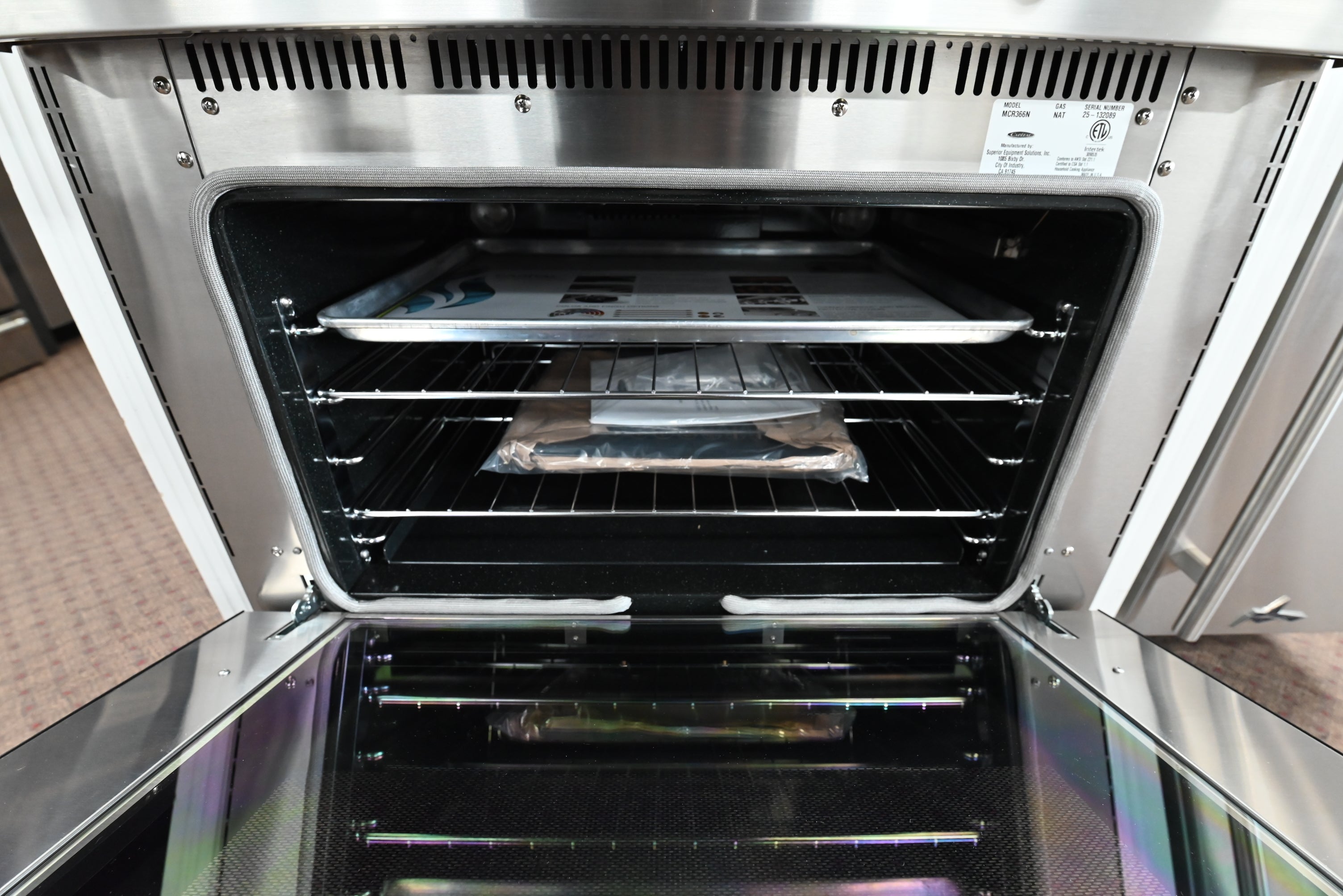 Close up of Capital MCR366N burner grates and die-cast chrome control knob
