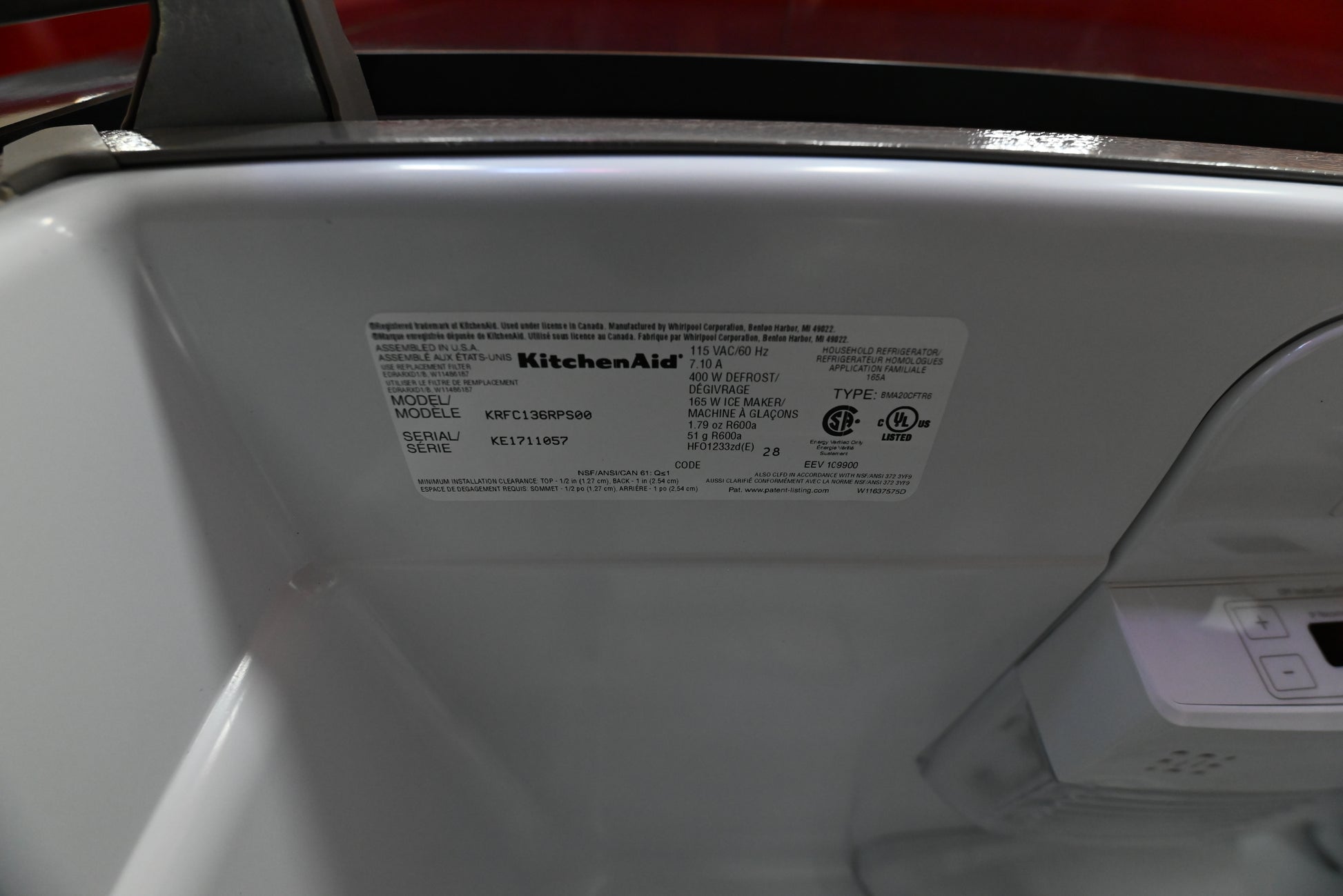 KitchenAid counter depth refrigerator interior detail showing hidden flush wall water dispenser
