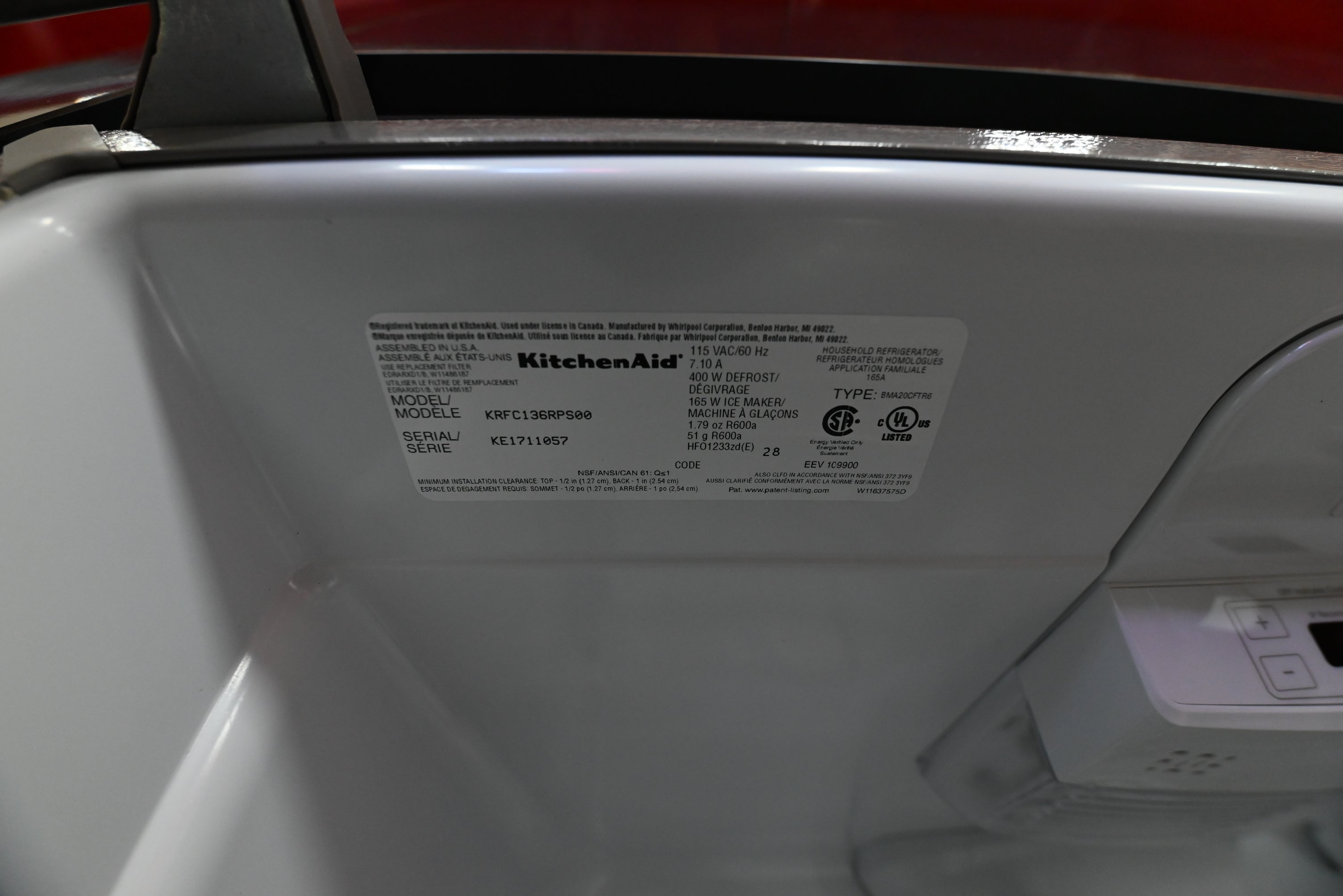 KitchenAid counter depth refrigerator interior detail showing hidden flush wall water dispenser