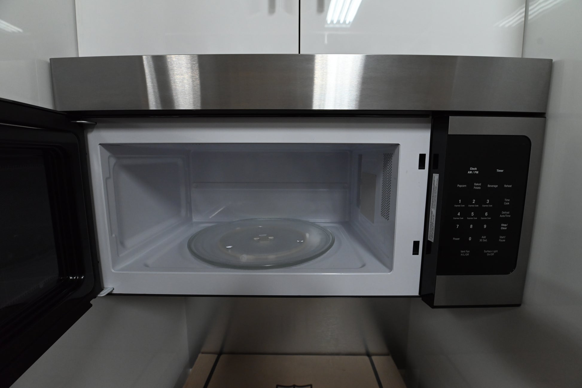 Blomberg 30 inch over the range microwave and ventilation hood installed securely under kitchen cabinets