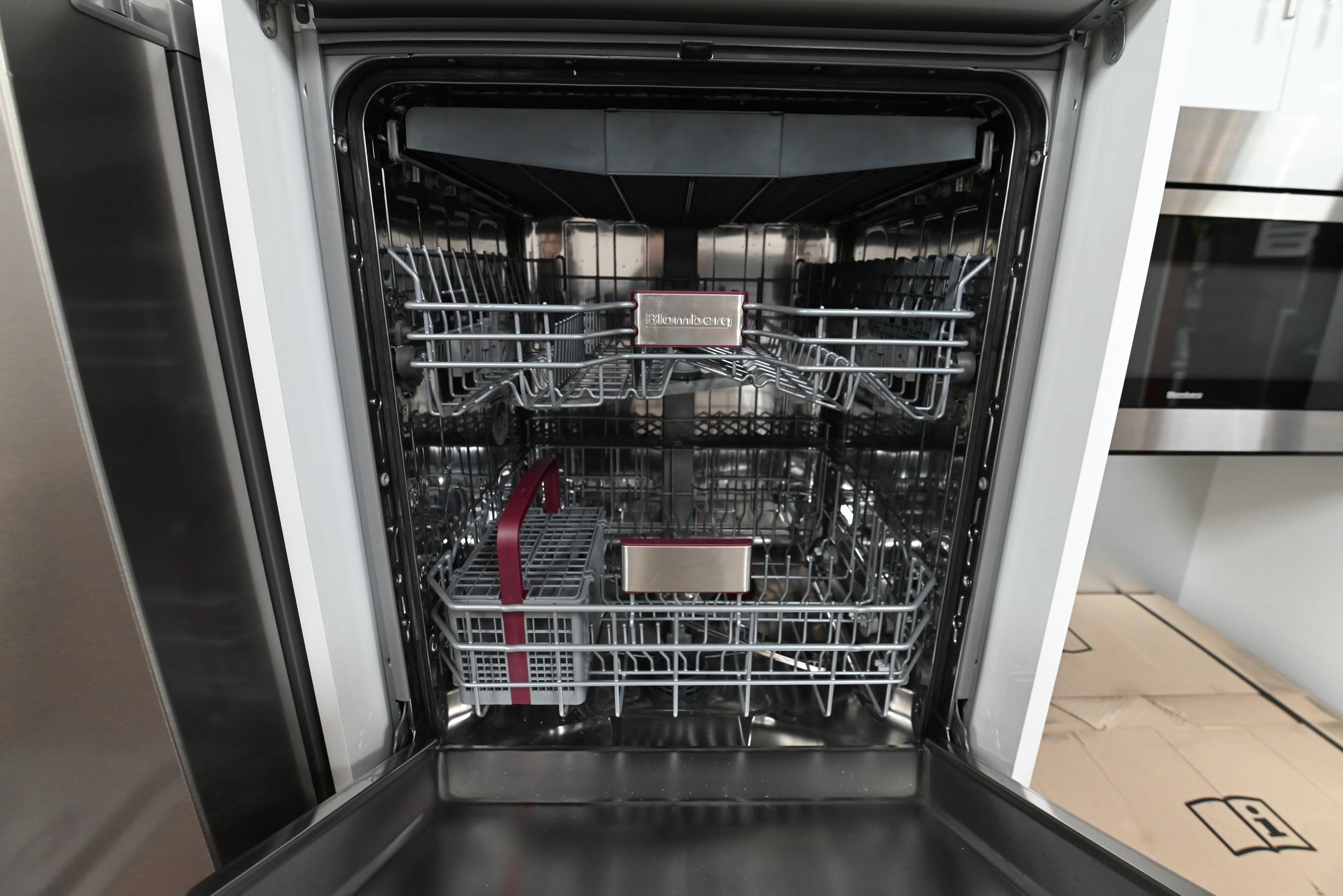 Blomberg 24 inch top control dishwasher installed flush inset with modern custom kitchen cabinets