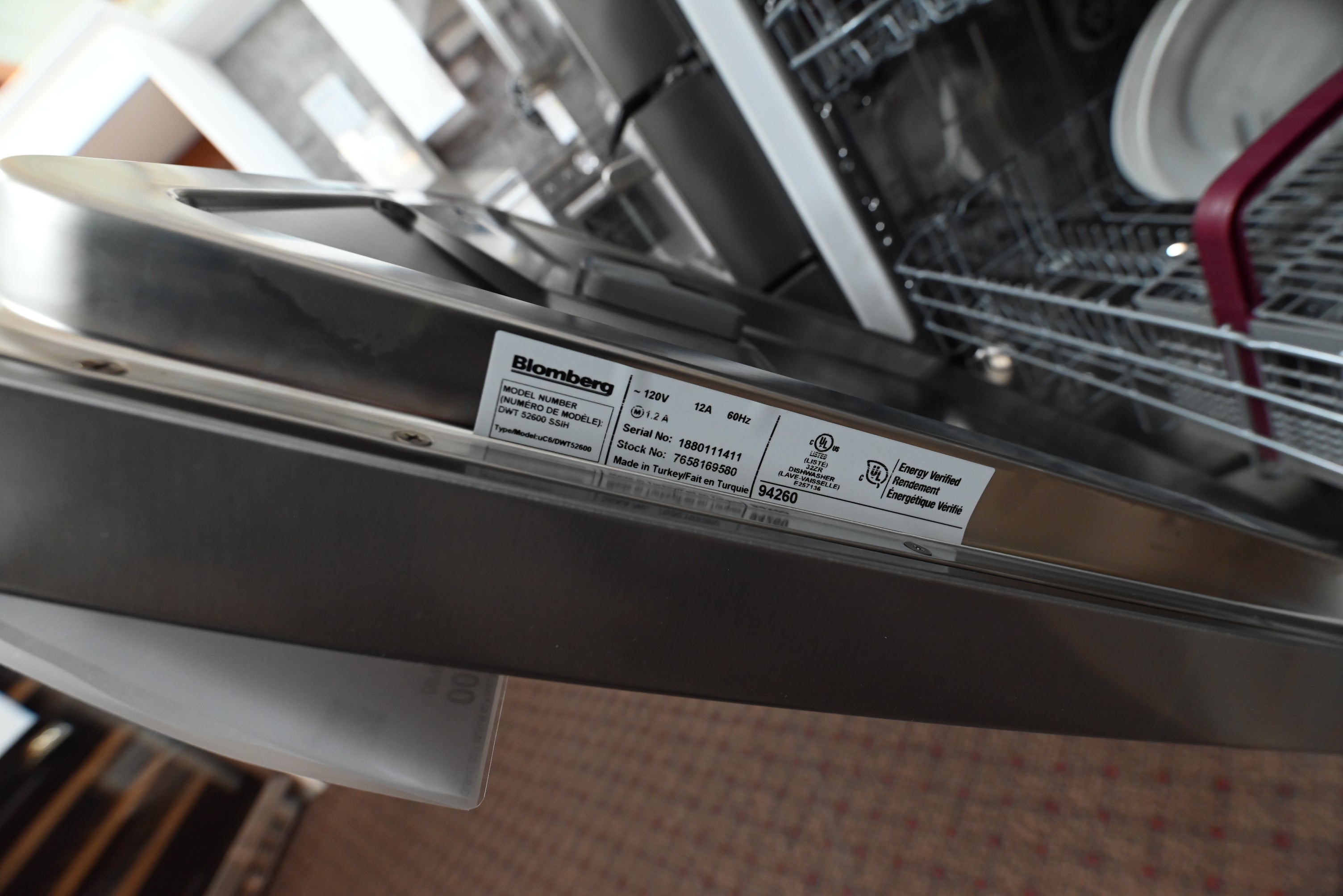 Blomberg 24 inch dishwasher with pocket handle installed under custom kitchen quartz countertops