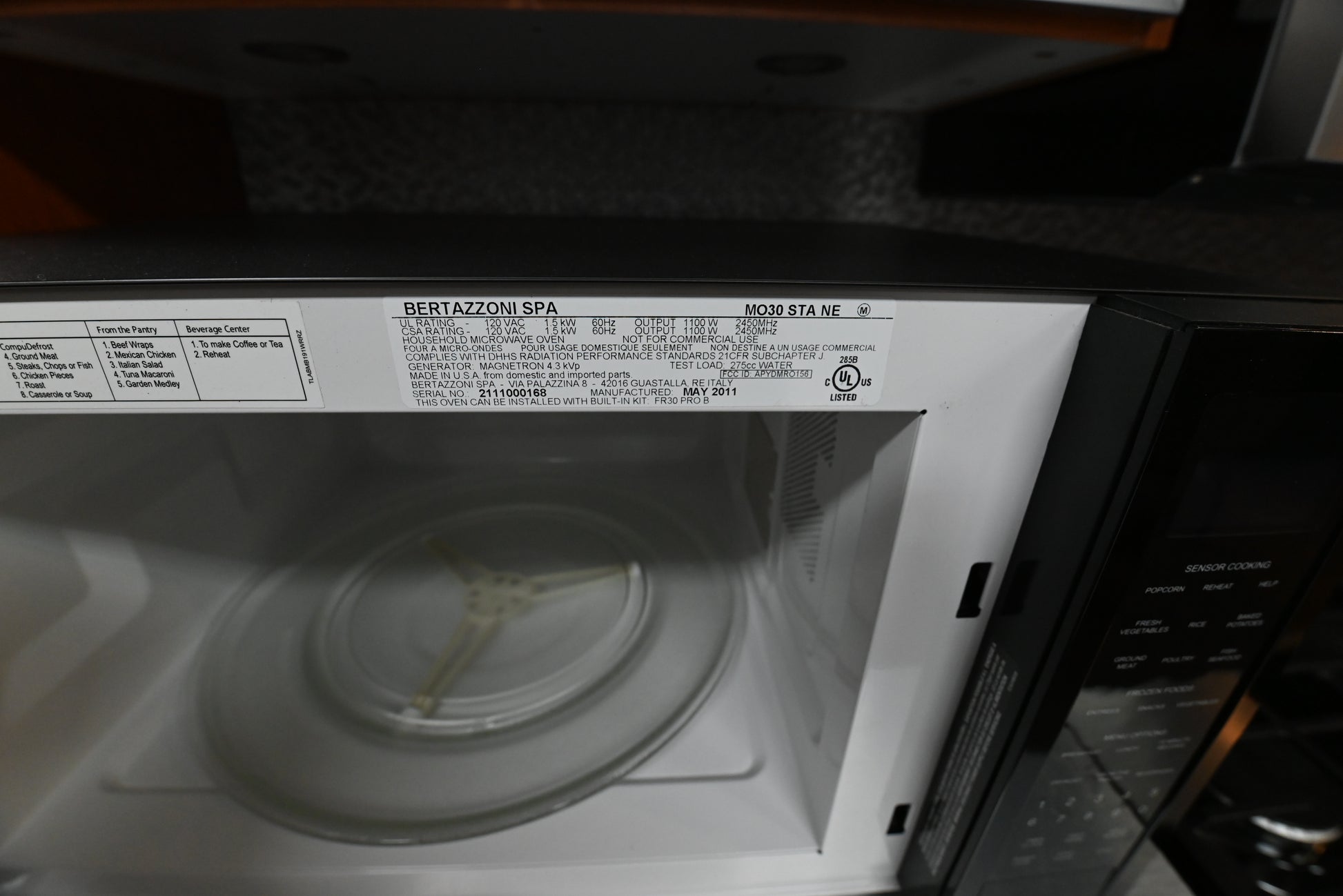 Bertazzoni 2.0 cu ft microwave sitting on modern kitchen island countertop profile