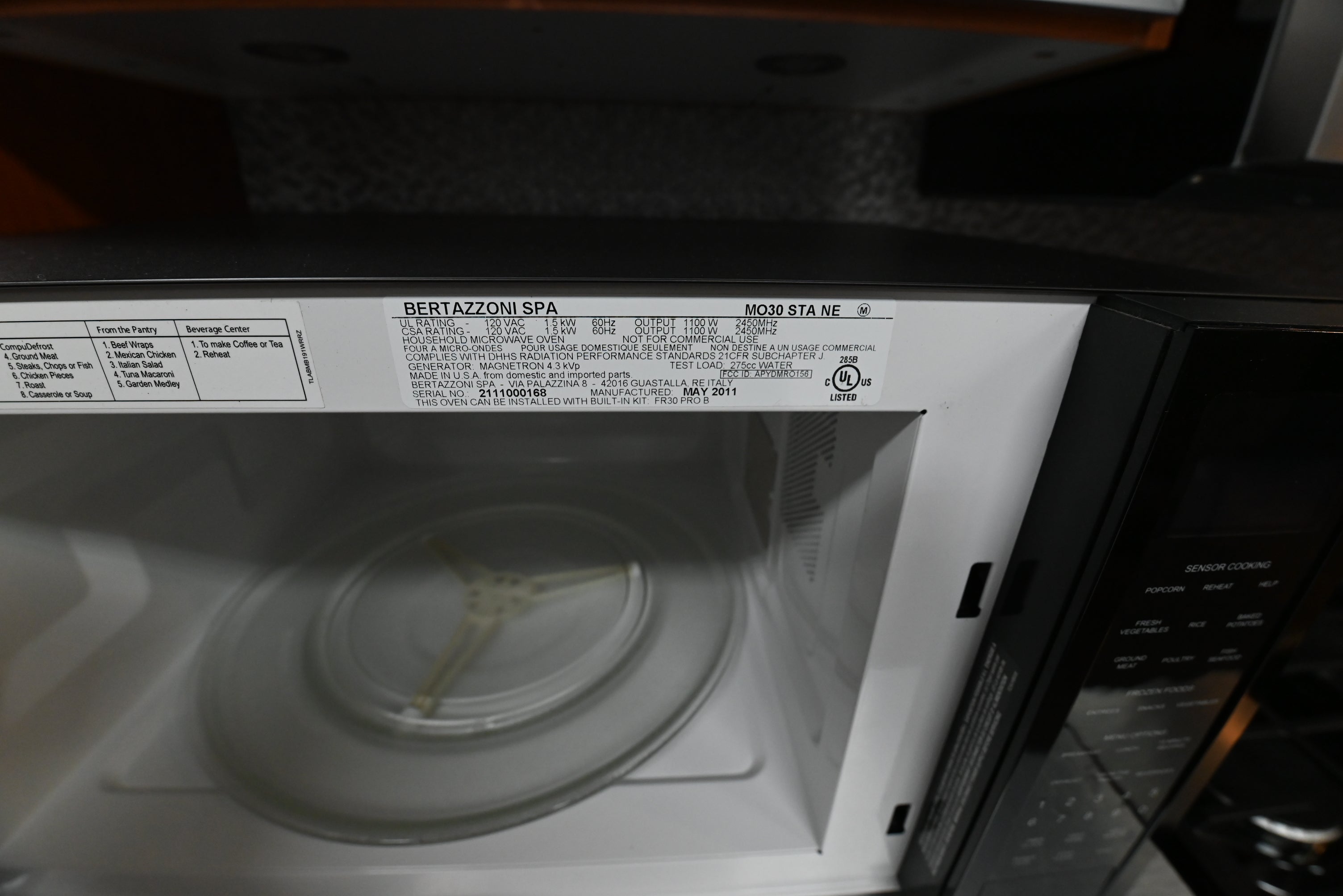 Bertazzoni 2.0 cu ft microwave sitting on modern kitchen island countertop profile