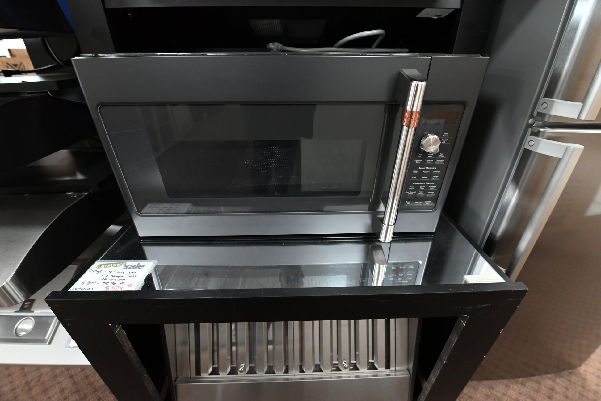 Cafe CVM517P3MD1 30 inch convection over the range microwave oven front view in matte black
