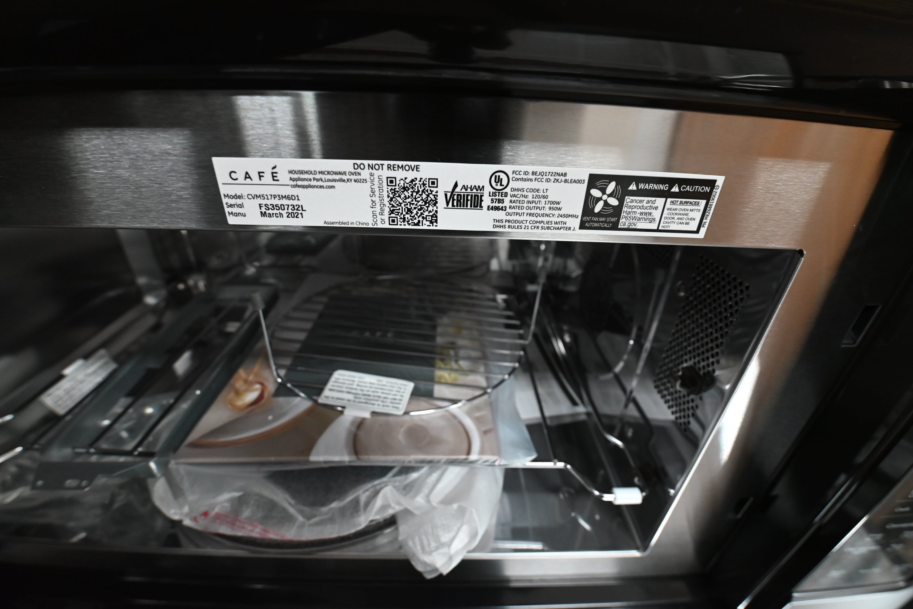 Cafe smart combination microwave showing open door and internal stainless steel convection cavity