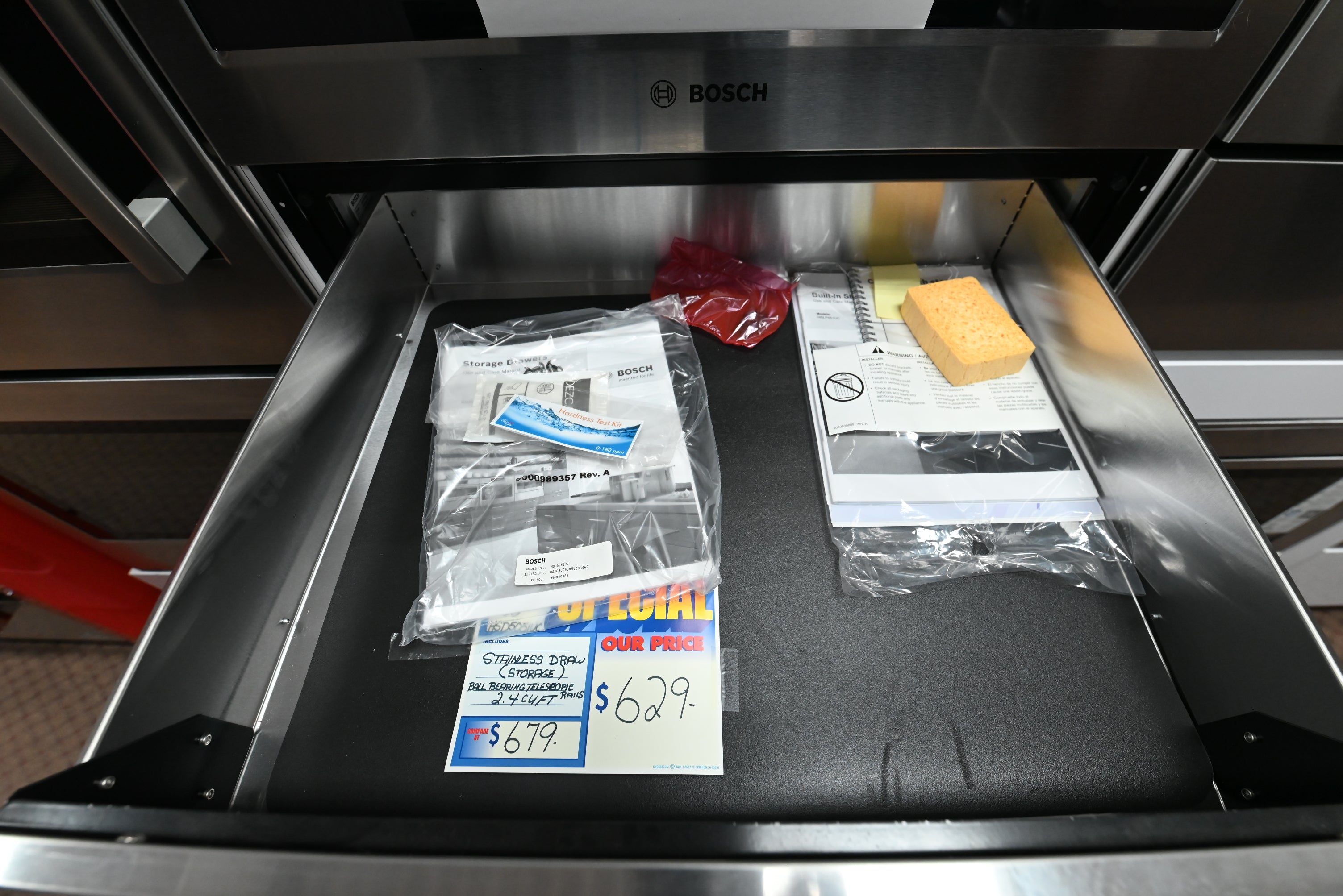 Luxury 30 inch integrated storage drawer open showing telescopic rails and rubber mat lining