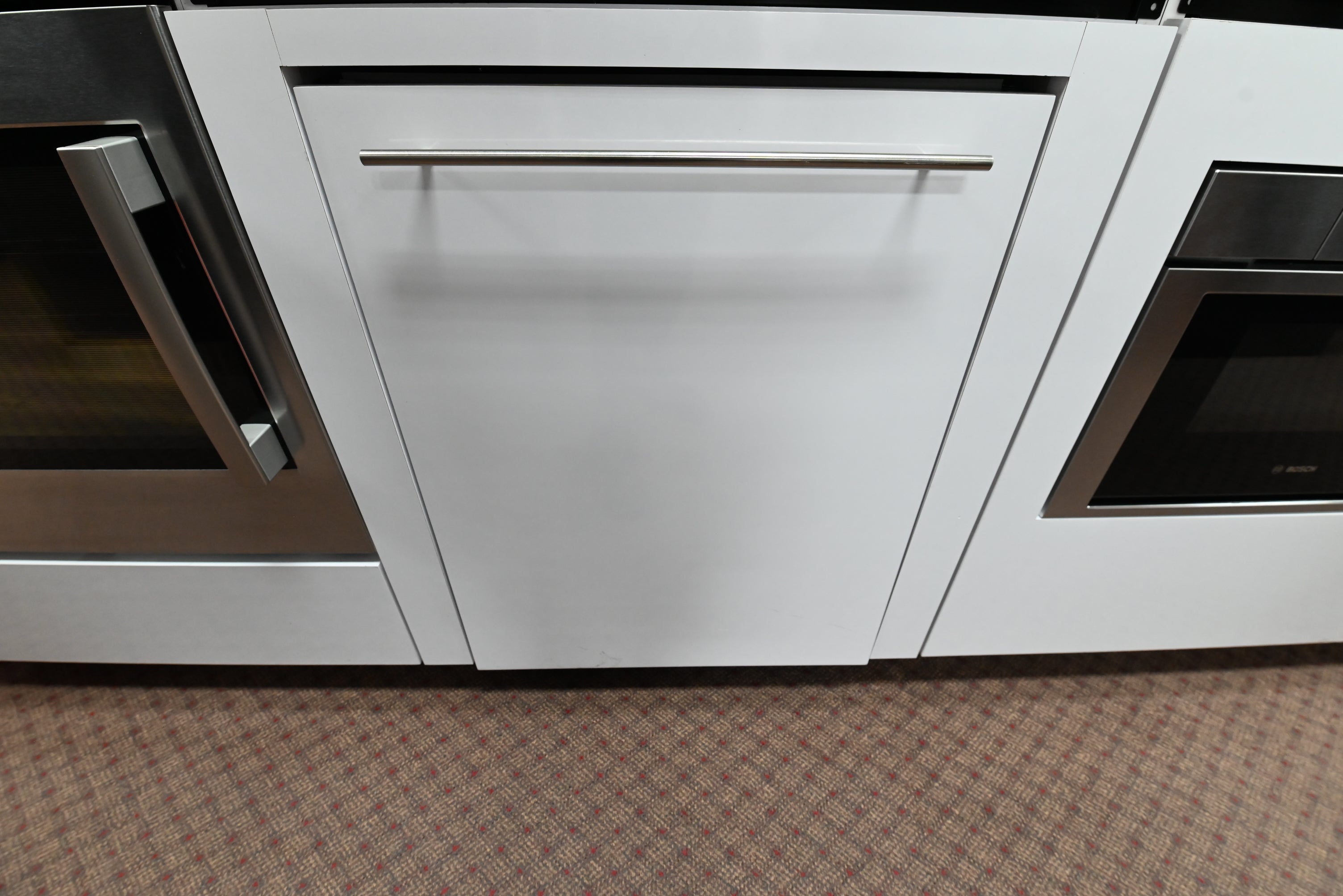 Bosch SHV89PW73N Benchmark 24 inch fully integrated panel ready dishwasher front view ready for wood panel