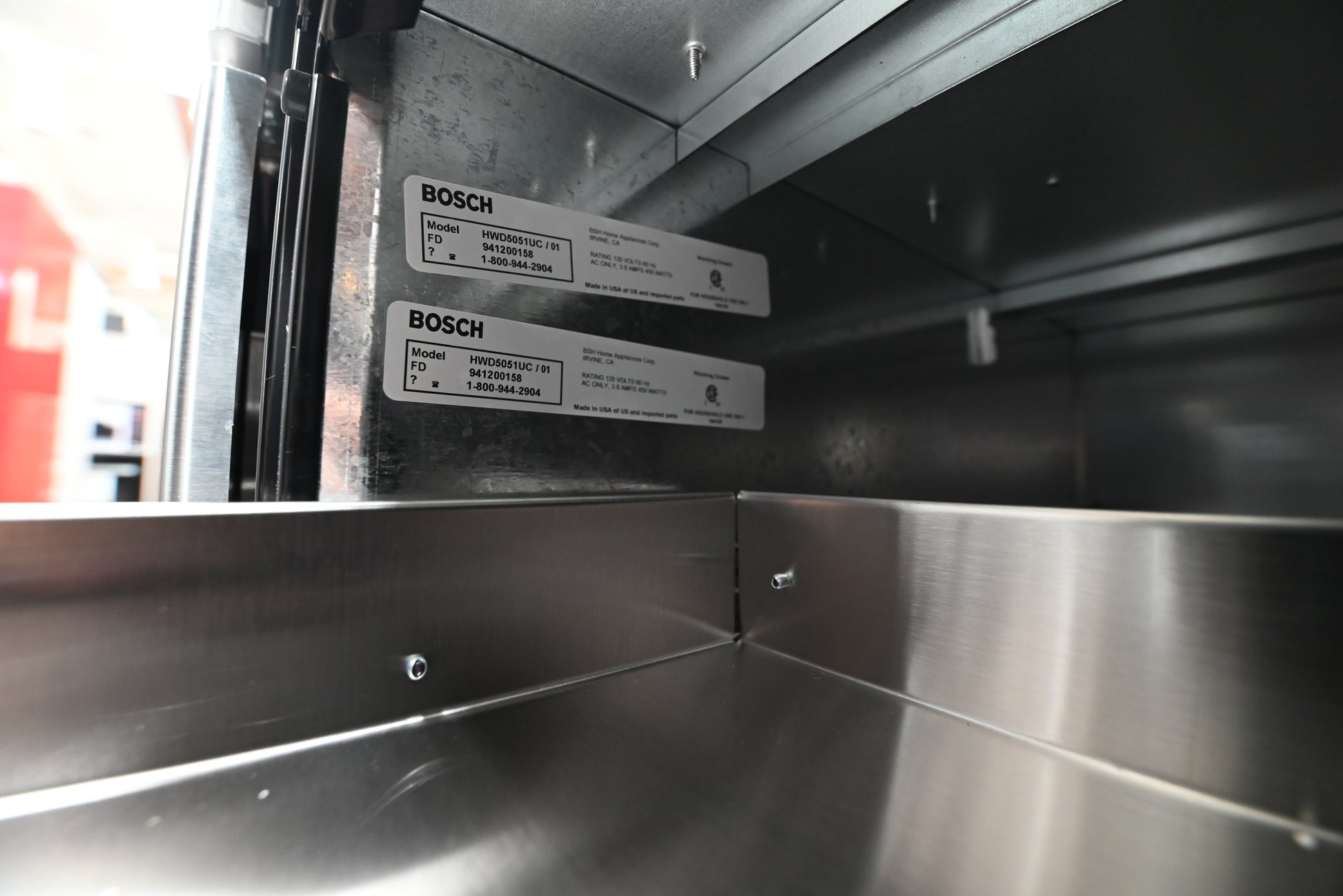 Bosch 30 warming drawer installed flush underneath a matching built in single wall oven