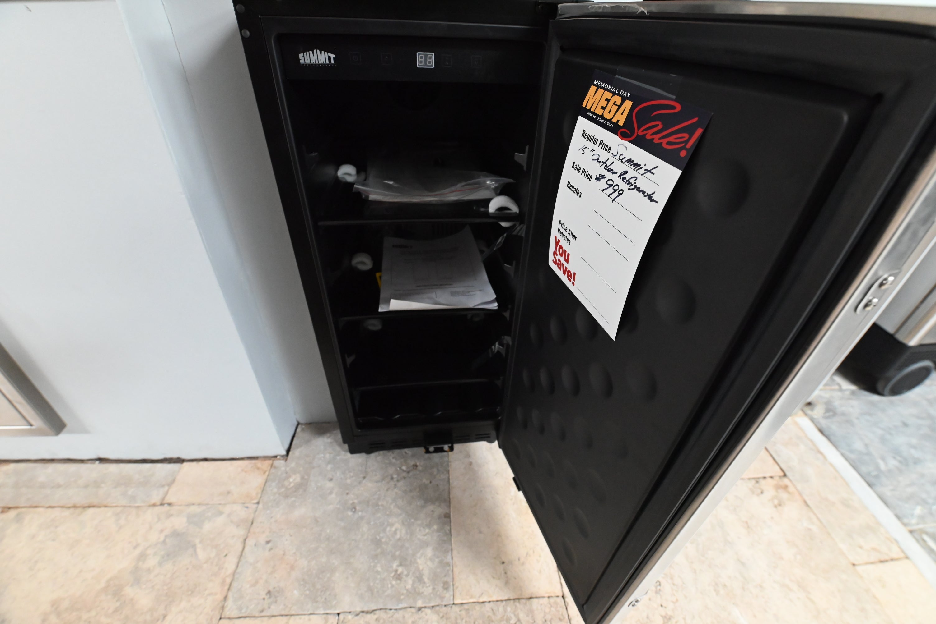 Luxury 15 inch outdoor kitchen island refrigerator open showing glass shelves and wine slots
