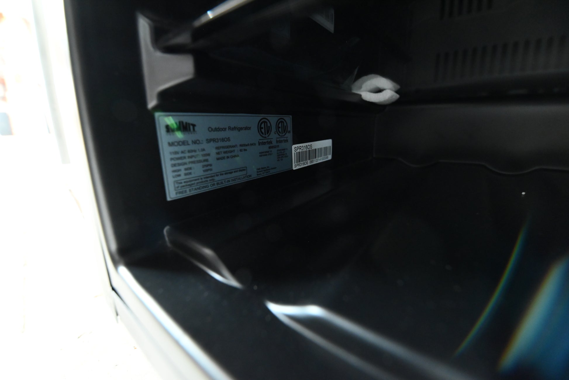 Summit 15 undercounter fridge close up showing digital display controls and door lock
