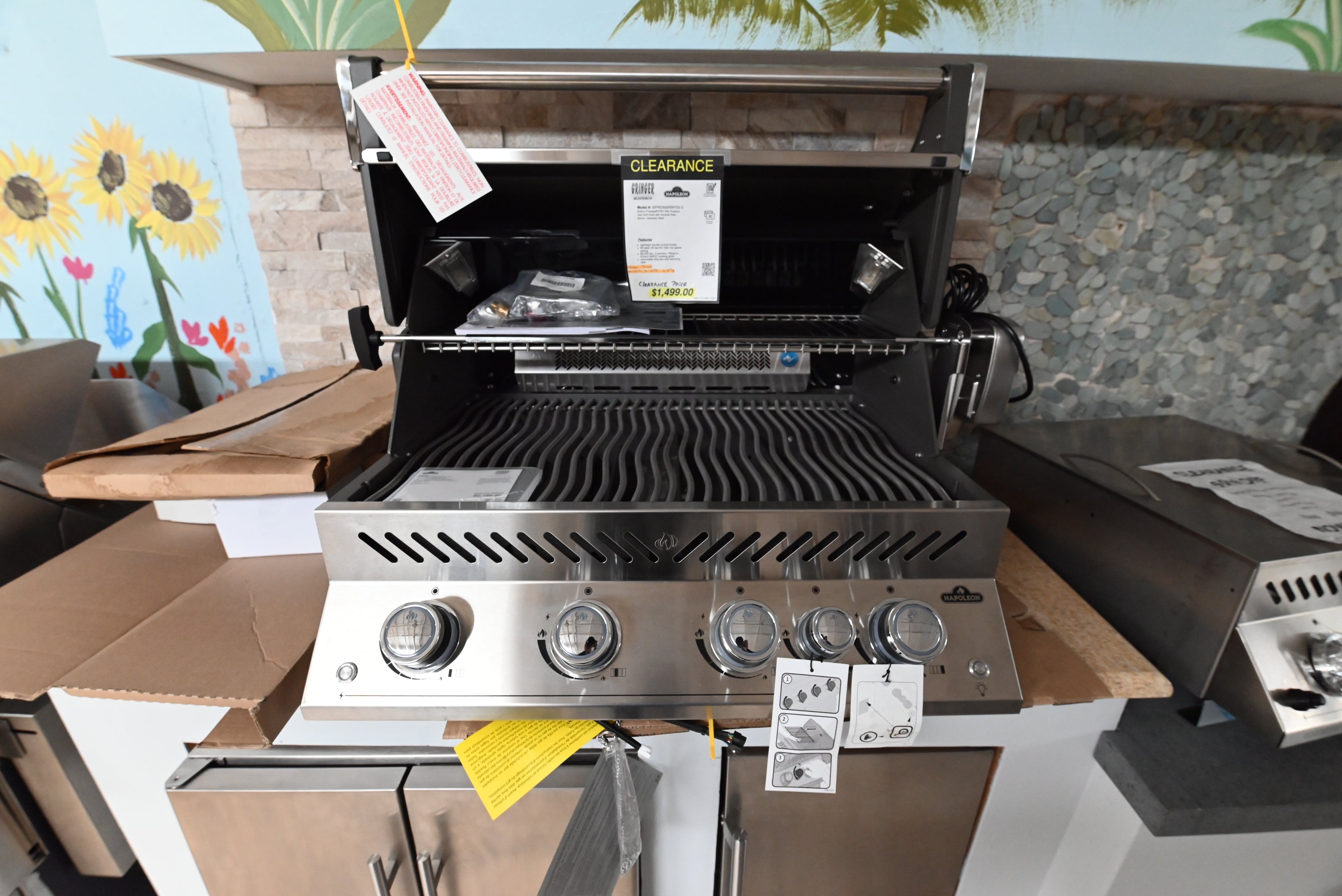 Luxury 33 inch outdoor built in grill open showing heavy 9.5mm stainless steel wave cooking grids