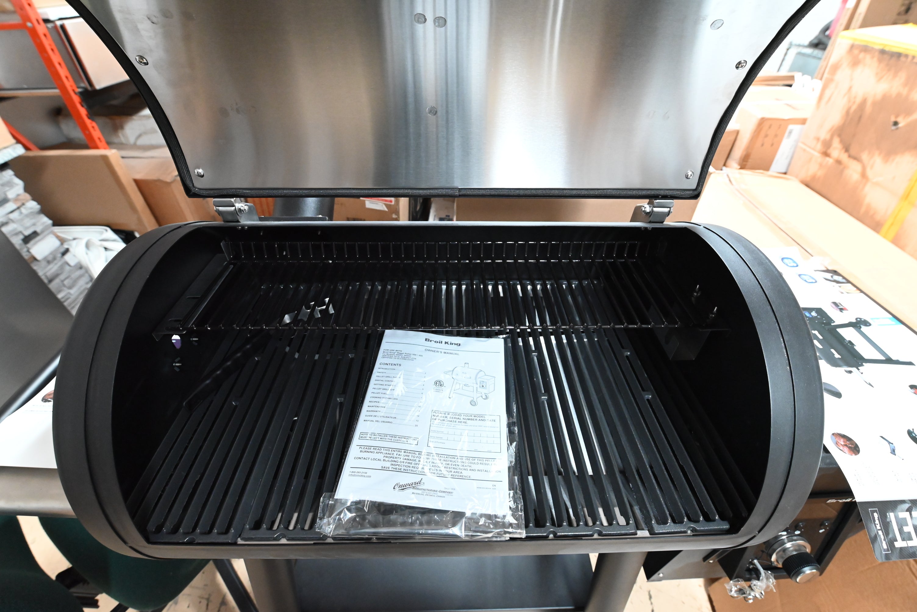 Luxury 32 inch smart pellet grill open showing porcelain coated cast iron grids and rotisserie kit