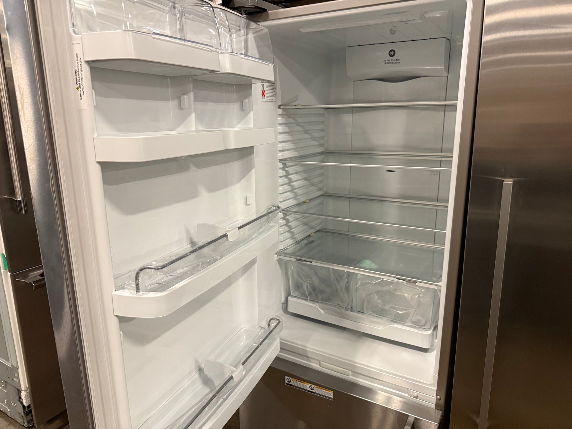 Fisher & Paykel RF135BDLUX4N 25" Stainless Steel Counter Depth Bottom Freezer Refrigerator