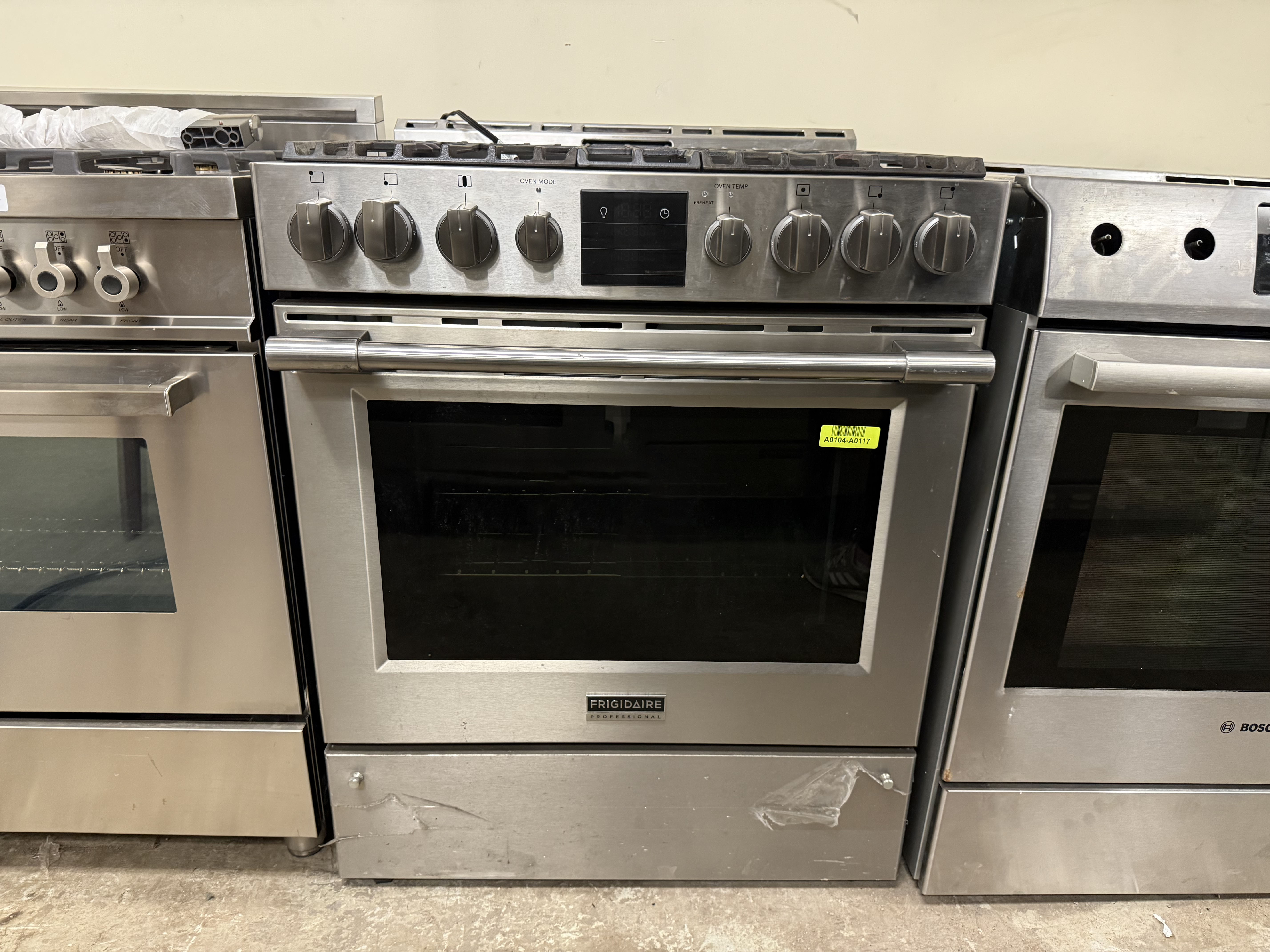 Stainless steel ovens in a showroom setting