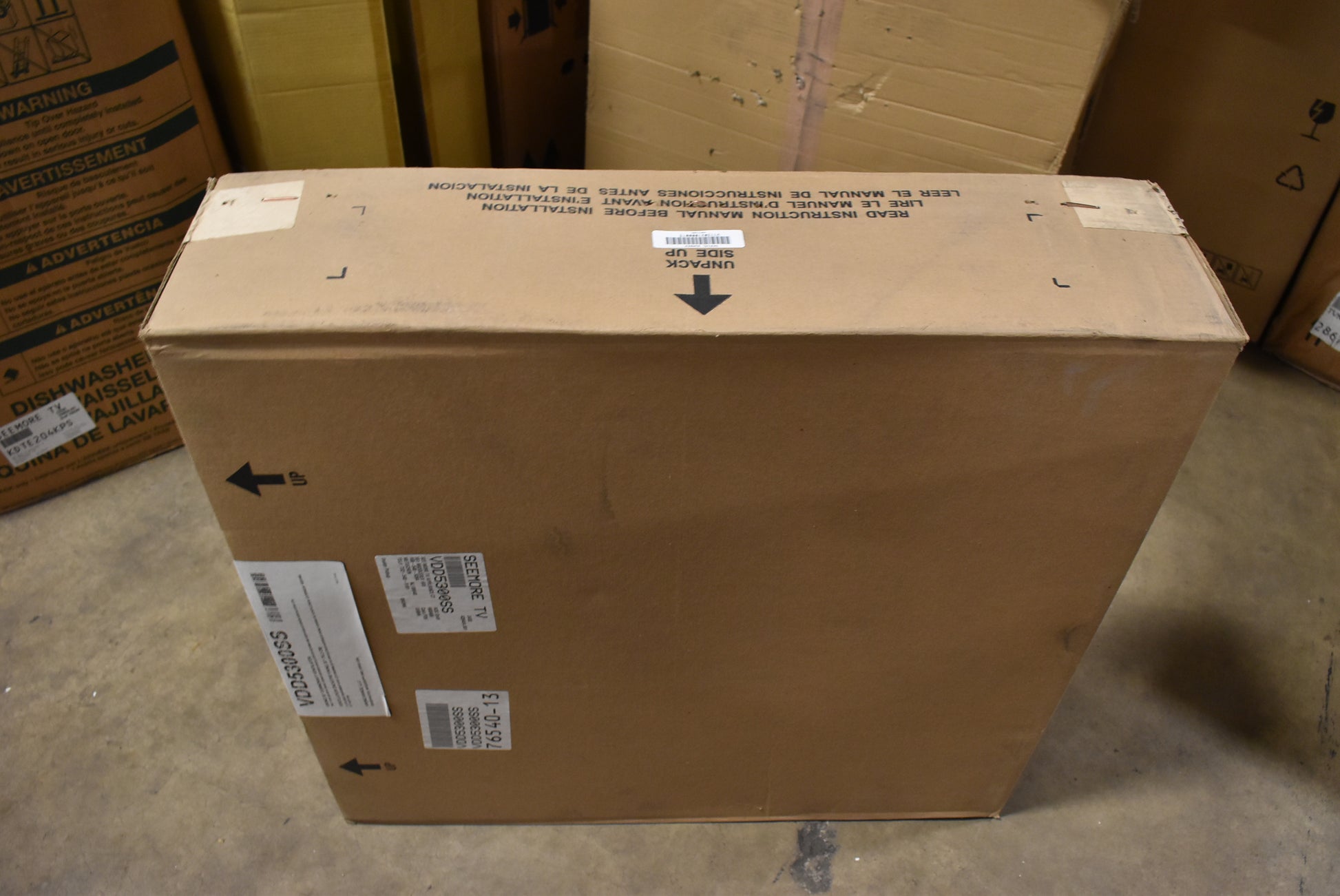 Cardboard box with labels in a storage area