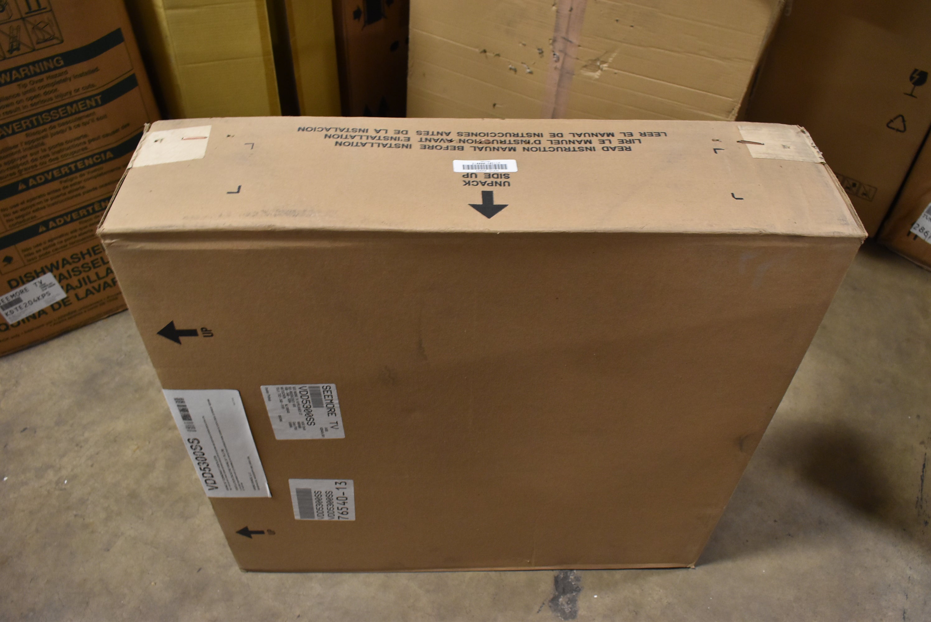 Cardboard box with labels in a storage area