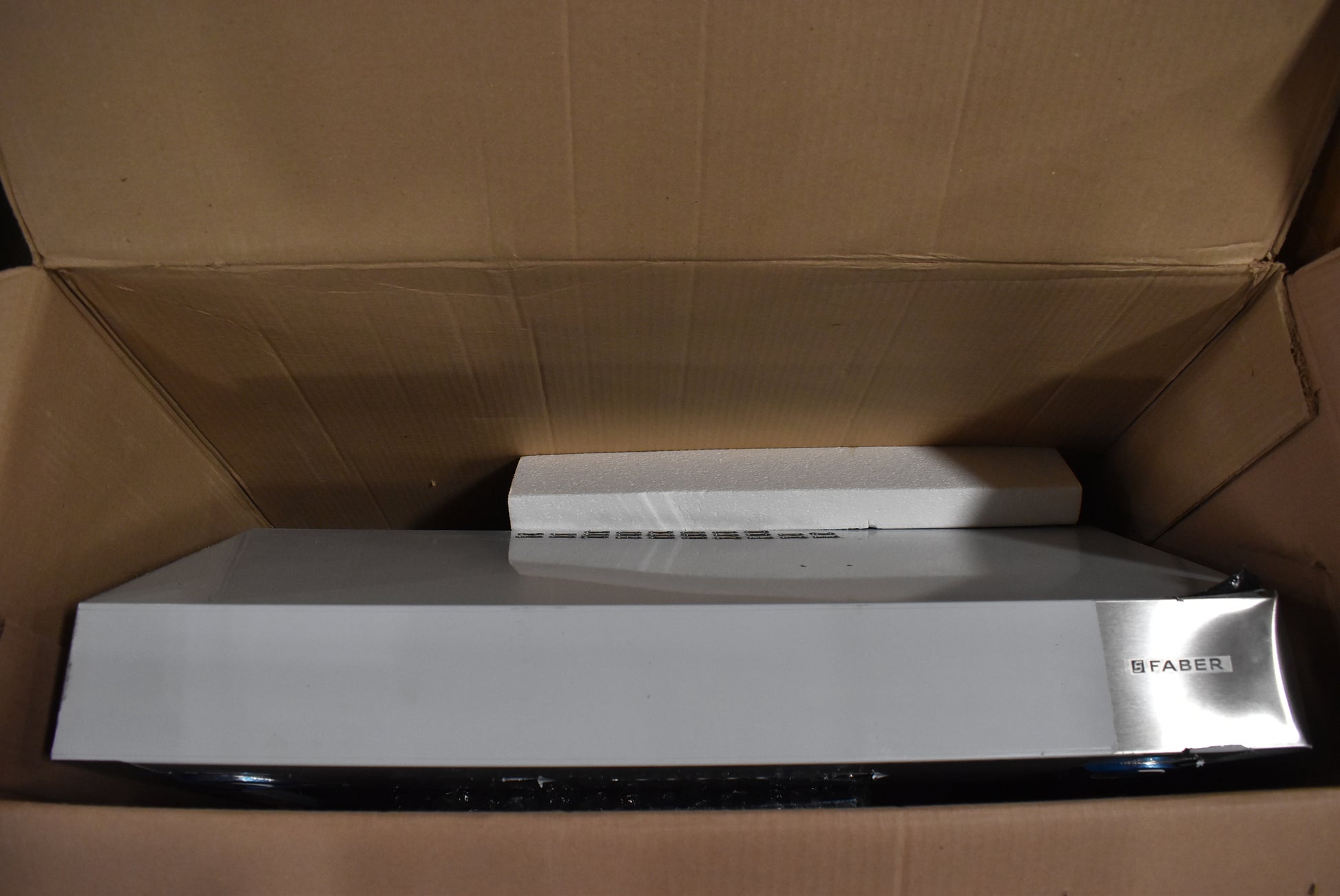 Professional under-cabinet range hood by Faber with electronic controls
