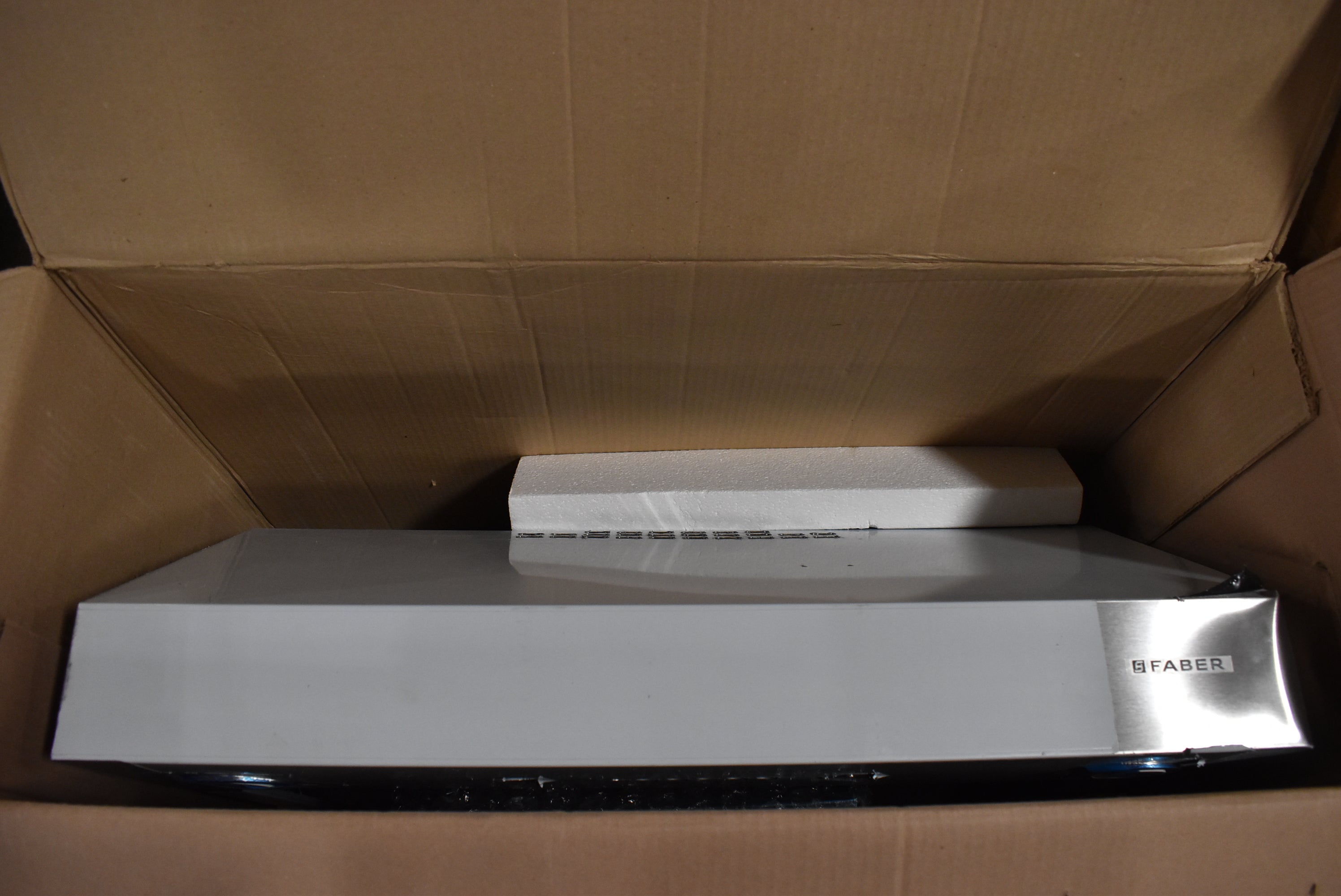 Professional under-cabinet range hood by Faber with electronic controls