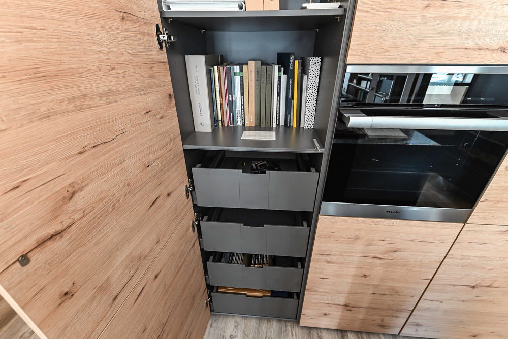 Nolte Küchen Modern Black Kitchen with Unique Accent Wall Cabinetry