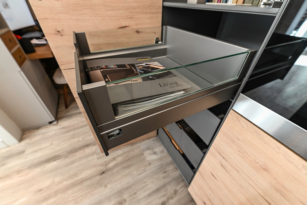Nolte Küchen Modern Black Kitchen with Unique Accent Wall Cabinetry