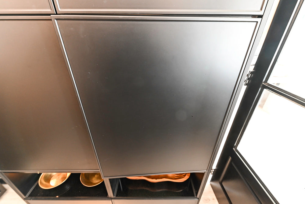 Nolte Küchen Modern Black Kitchen with Unique Accent Wall Cabinetry