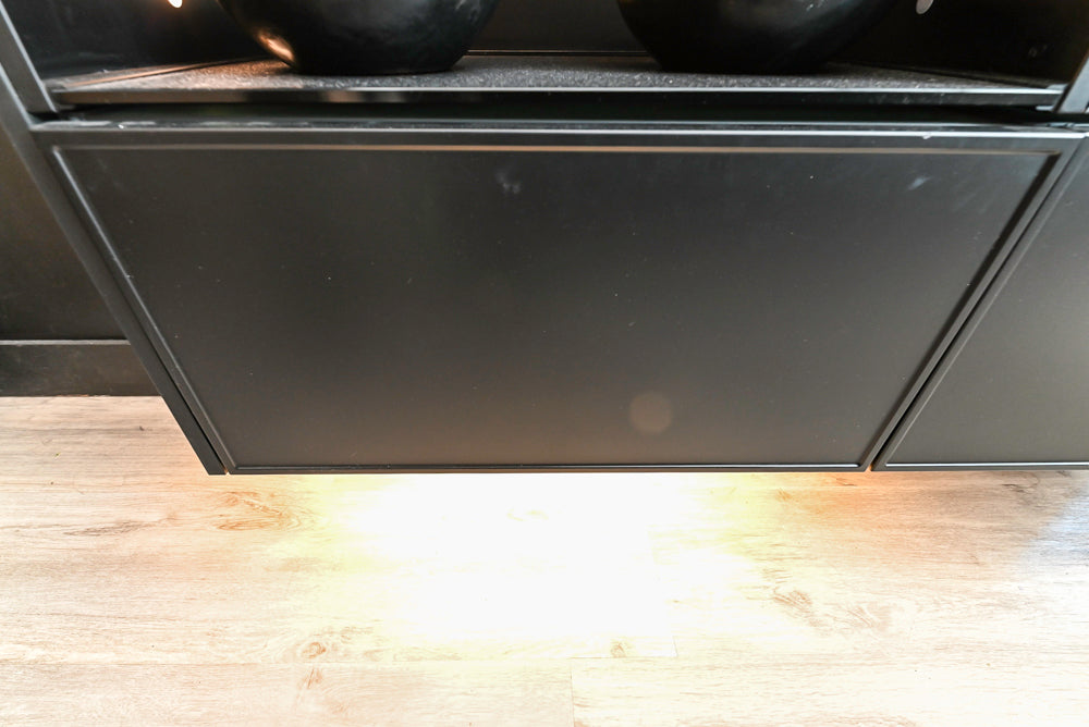 Nolte Küchen Modern Black Kitchen with Unique Accent Wall Cabinetry