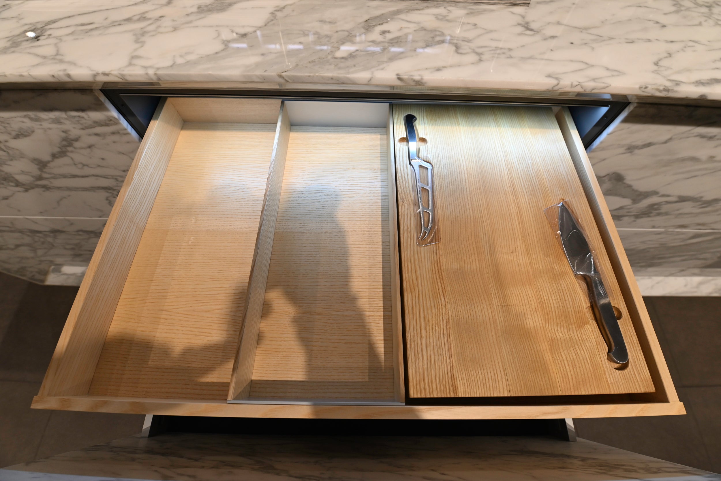 eggersmann USA Chablis Vintage Oak & Steel Grey Modern Kitchen with Arabescato Waterfall Island and Miele Appliance Suite