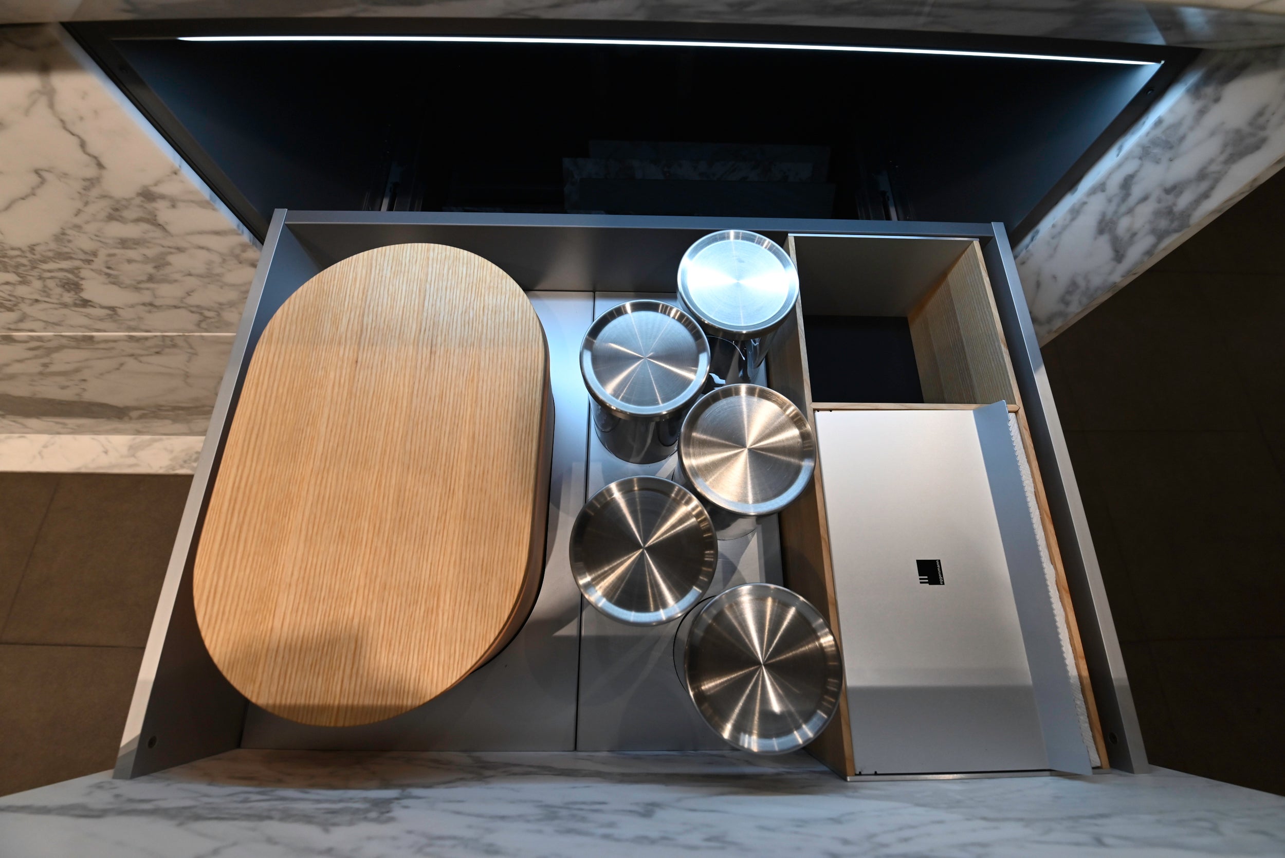 eggersmann USA Chablis Vintage Oak & Steel Grey Modern Kitchen with Arabescato Waterfall Island and Miele Appliance Suite