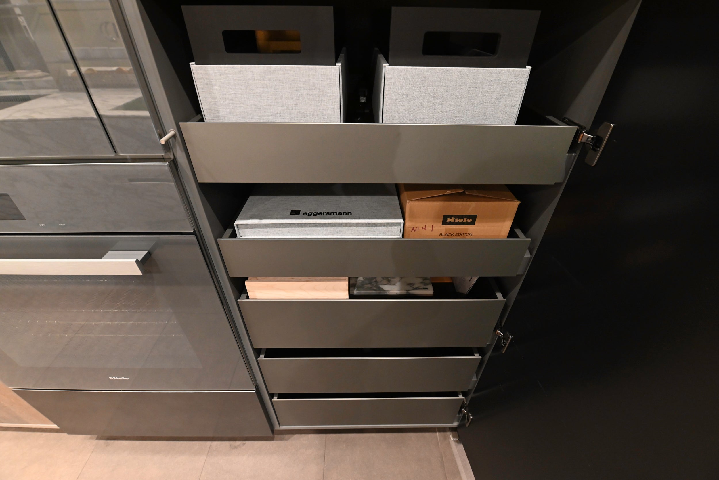 eggersmann USA Chablis Vintage Oak & Steel Grey Modern Kitchen with Arabescato Waterfall Island and Miele Appliance Suite