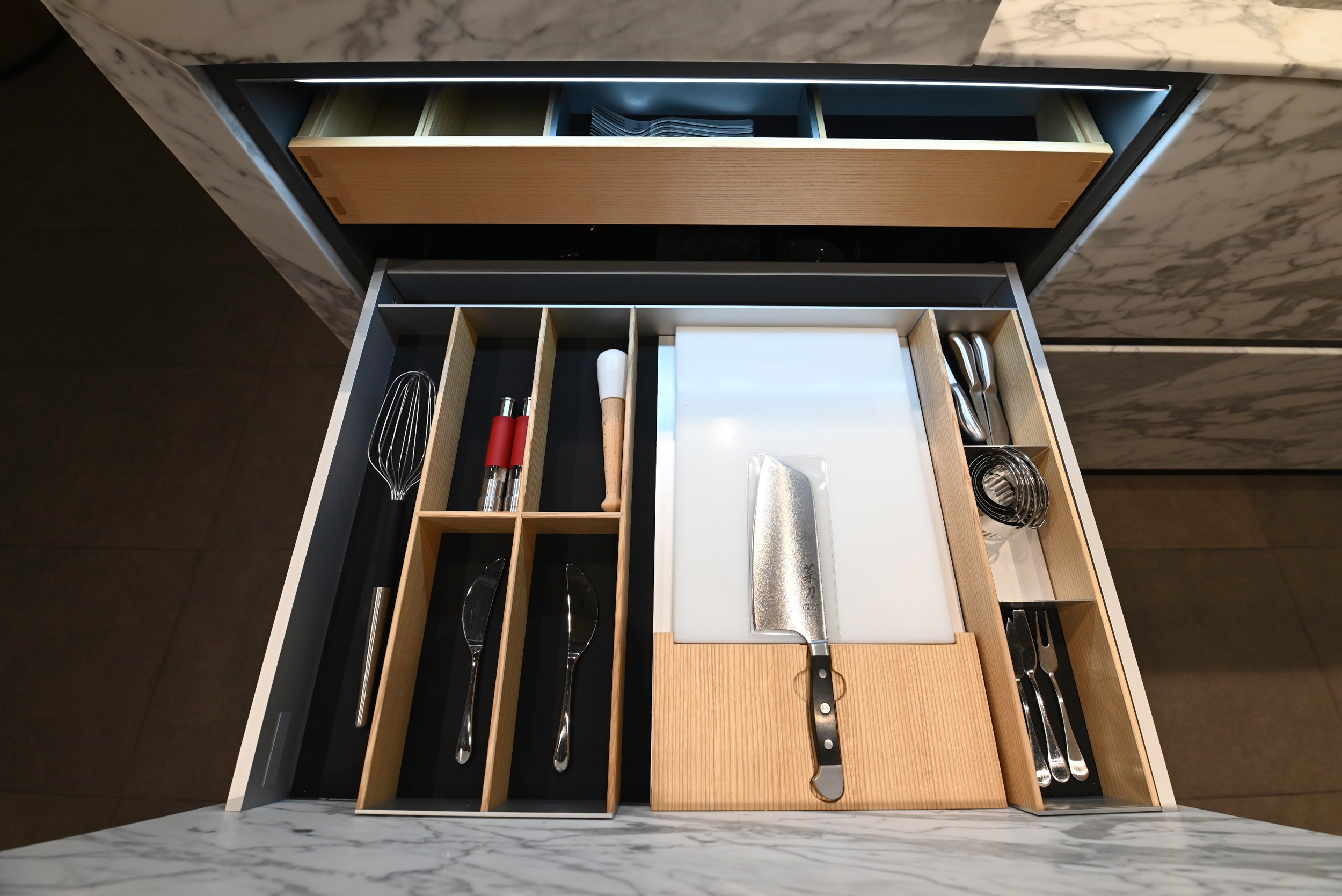 eggersmann USA Chablis Vintage Oak & Steel Grey Modern Kitchen with Arabescato Waterfall Island and Miele Appliance Suite