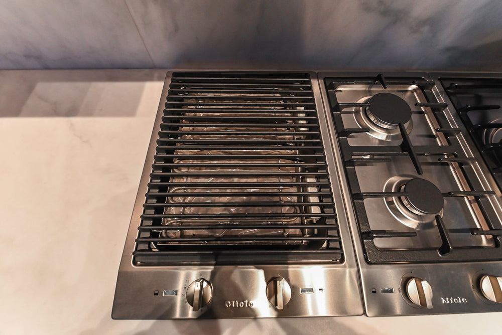 Modern White and Brown Wood Veneer Kitchen with Waterfall Island, Marble Countertops & Miele Appliances