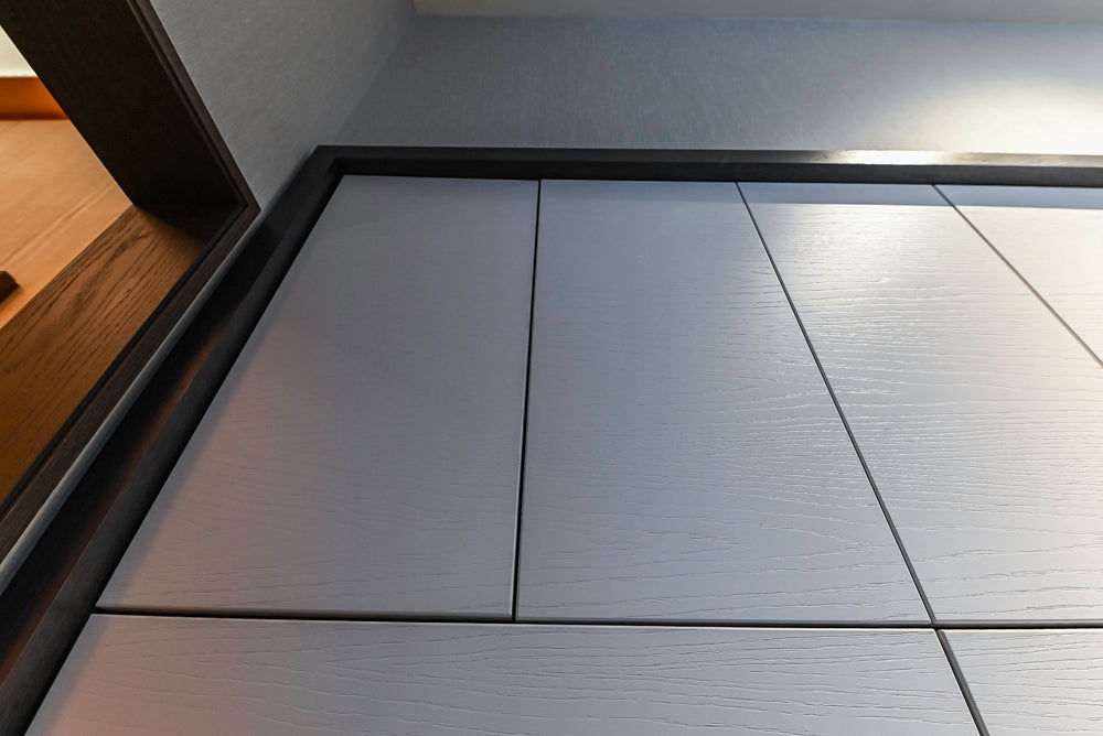 Modern White and Brown Wood Veneer Kitchen with Waterfall Island, Marble Countertops & Miele Appliances