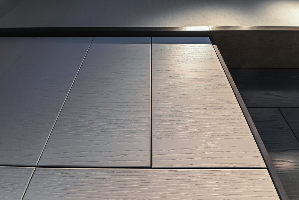 Modern White and Brown Wood Veneer Kitchen with Waterfall Island, Marble Countertops & Miele Appliances