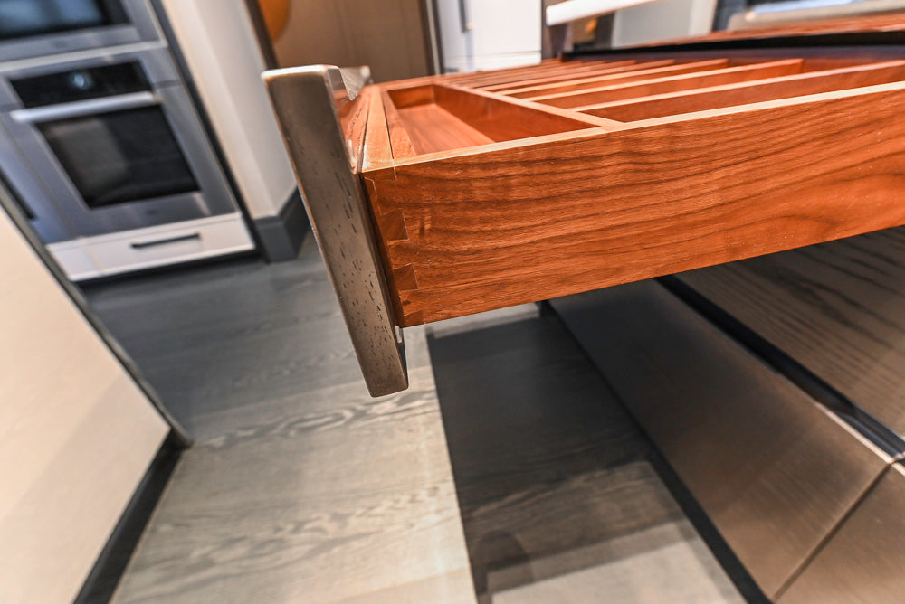 Modern White and Brown Wood Veneer Kitchen with Waterfall Island, Marble Countertops & Miele Appliances