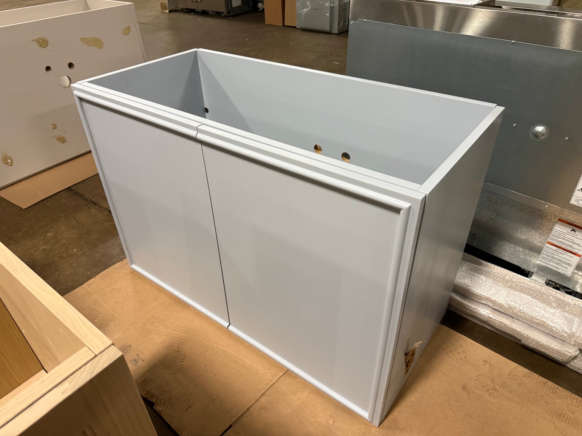 Close up view of the integrated white solid surface sink basin on a 47 inch modern grey vanity