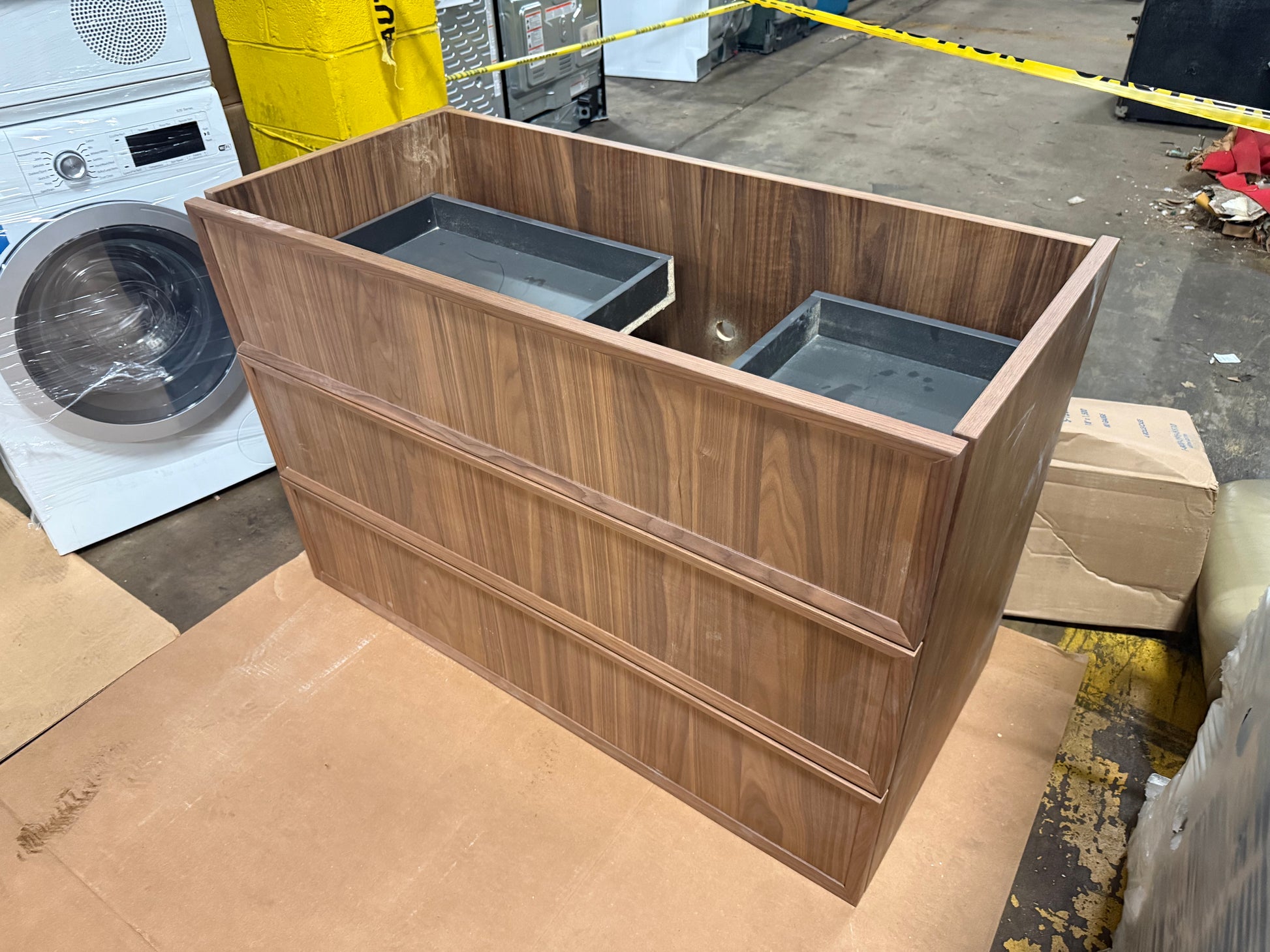 Luxury master bathroom featuring a 39 inch freestanding DOCA walnut vanity cabinet awaiting countertop installation