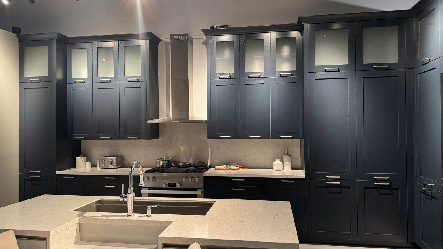 Häcker Velvet Blue & Light Grey Modern Kitchen with Island and Stone Countertops