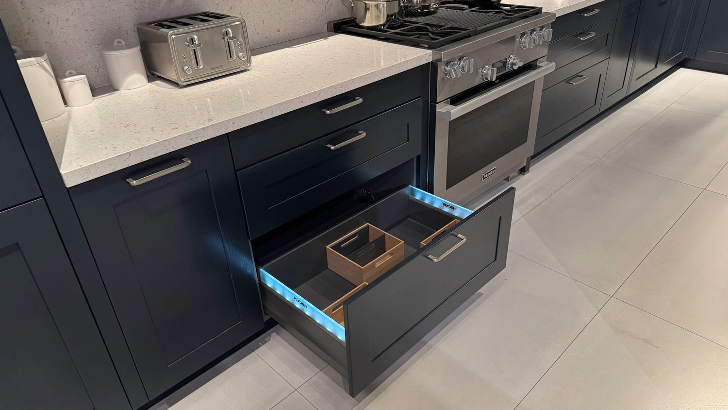 Häcker Velvet Blue & Light Grey Modern Kitchen with Island and Stone Countertops