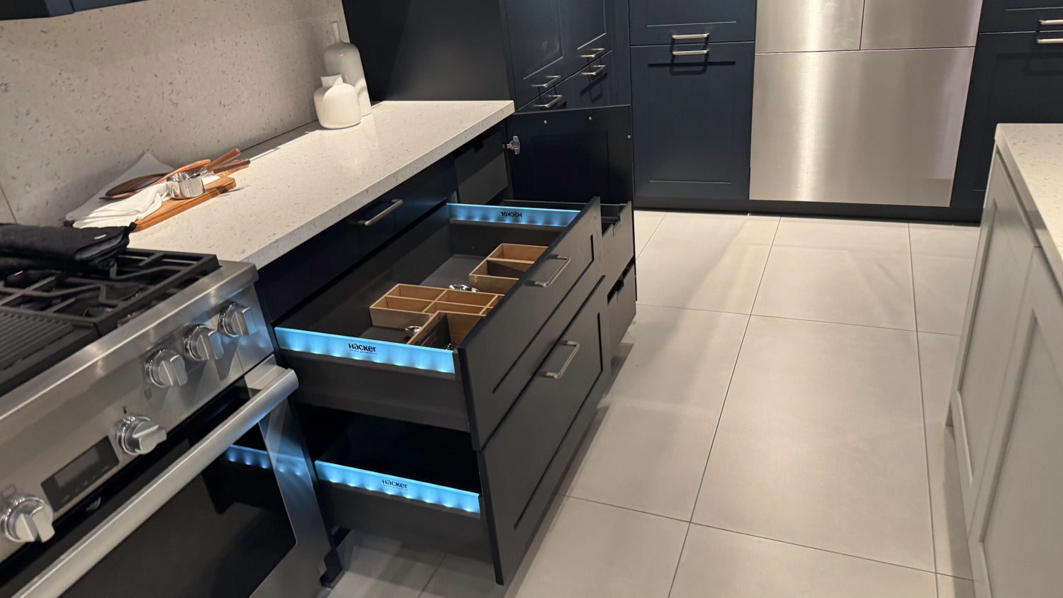 Häcker Velvet Blue & Light Grey Modern Kitchen with Island and Stone Countertops