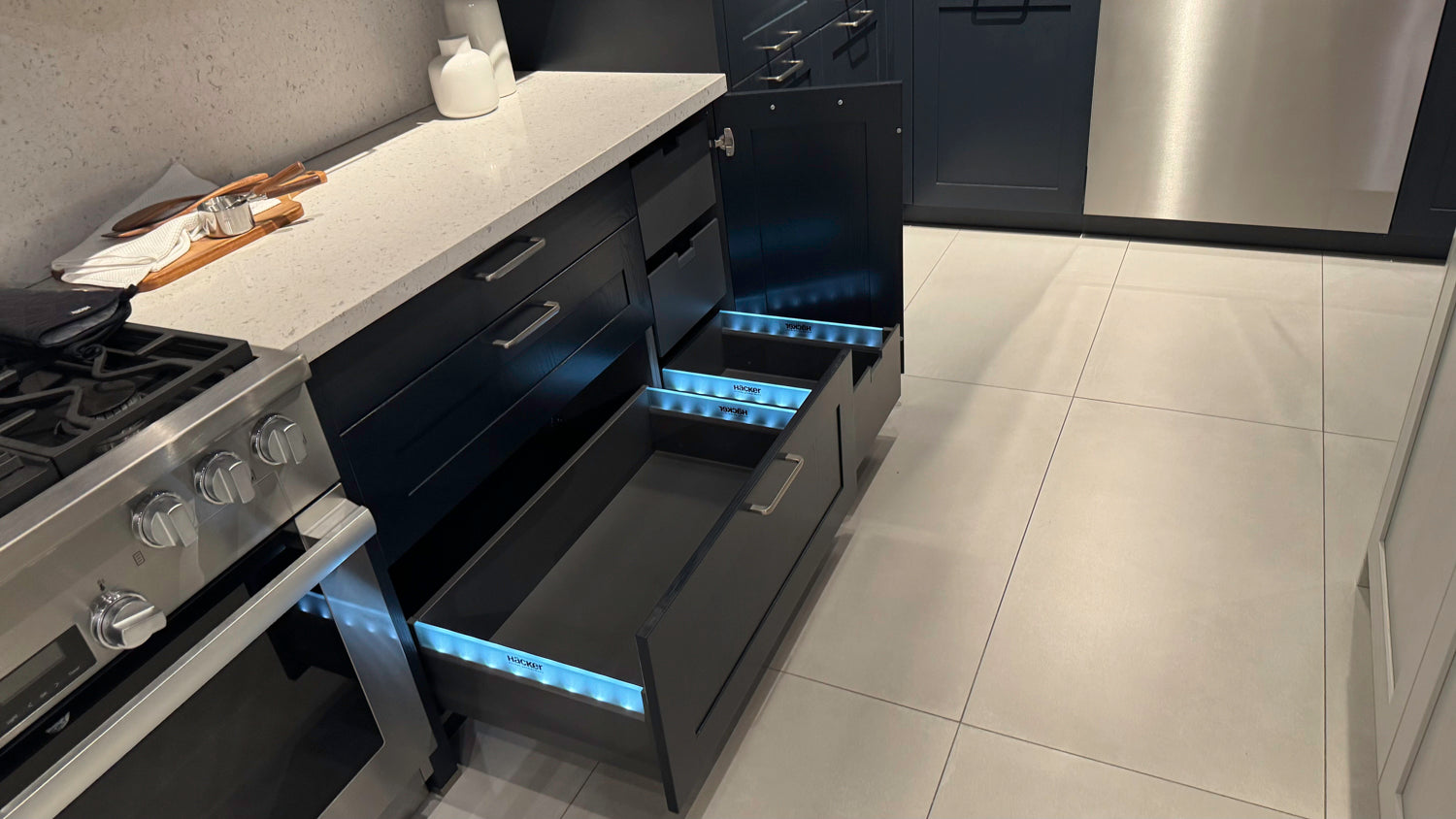 Häcker Velvet Blue & Light Grey Modern Kitchen with Island and Stone Countertops