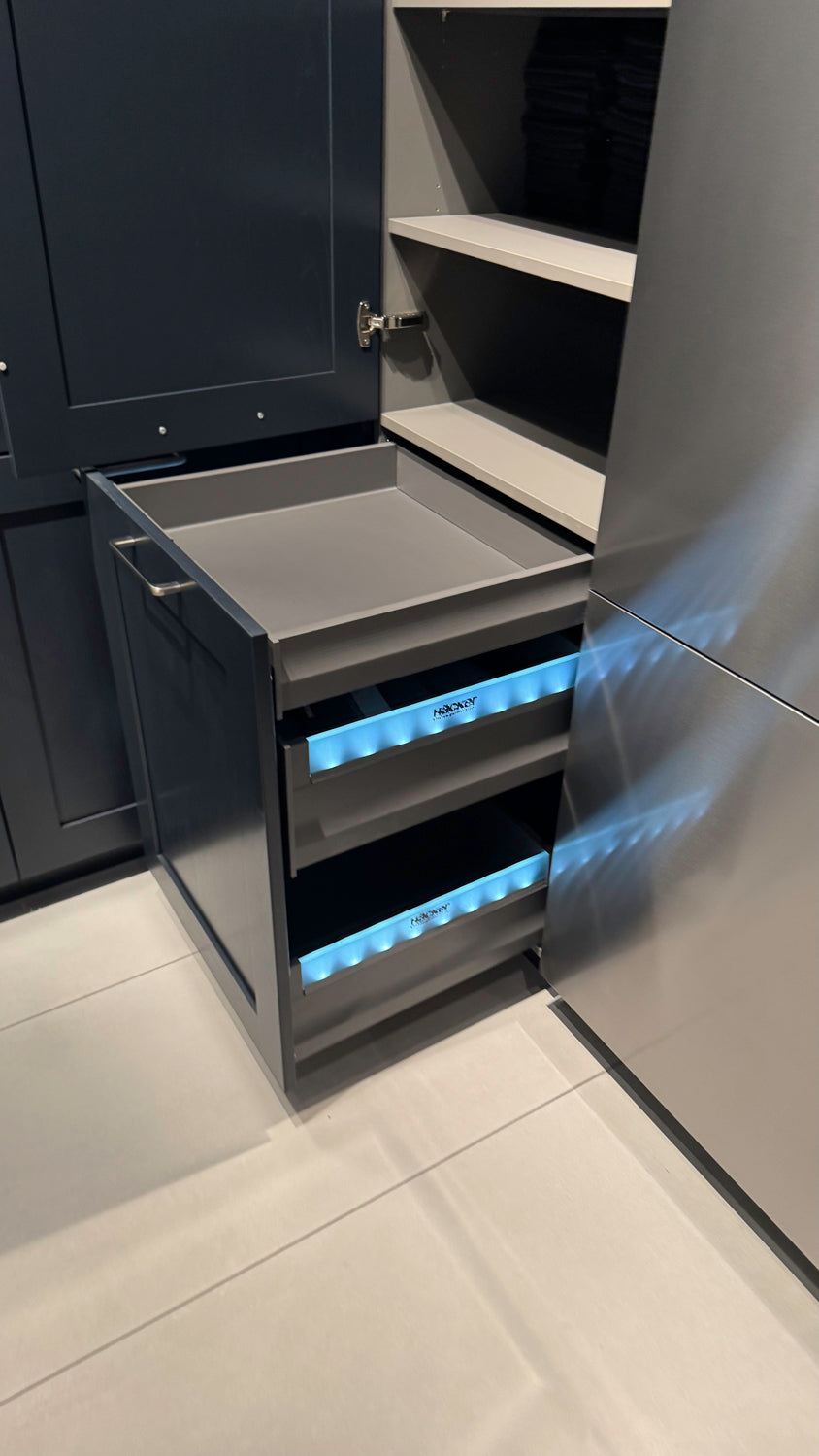 Häcker Velvet Blue & Light Grey Modern Kitchen with Island and Stone Countertops