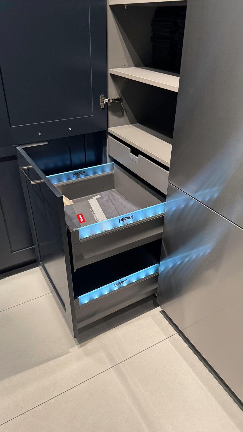 Häcker Velvet Blue & Light Grey Modern Kitchen with Island and Stone Countertops