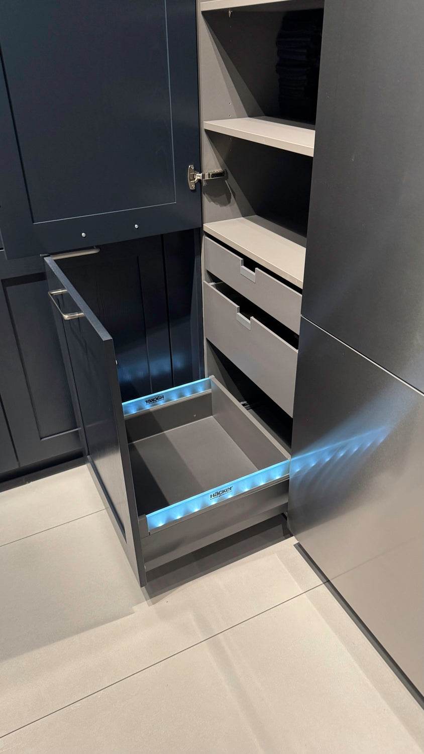 Häcker Velvet Blue & Light Grey Modern Kitchen with Island and Stone Countertops