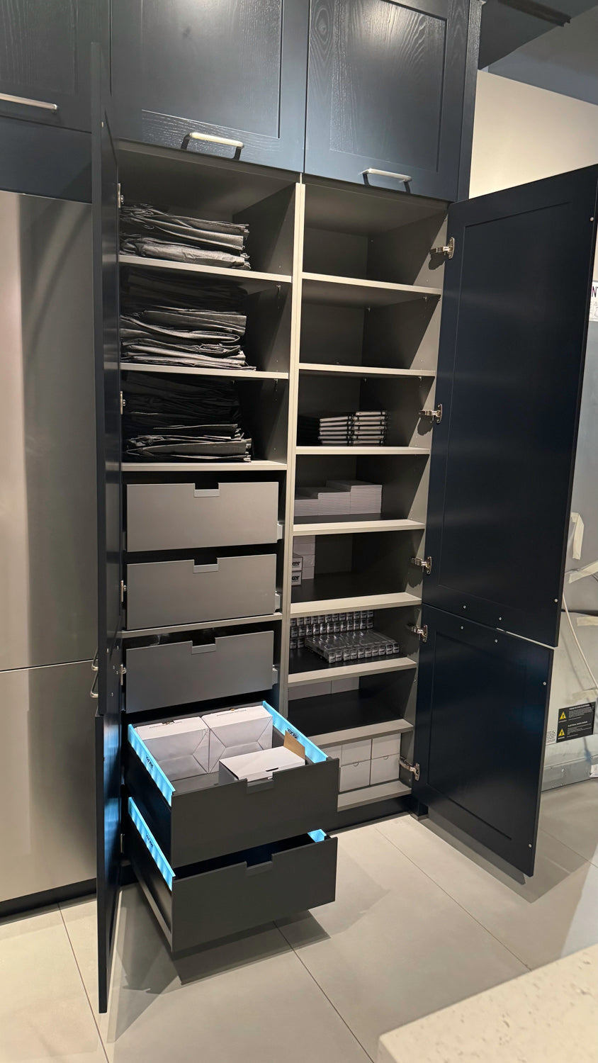 Häcker Velvet Blue & Light Grey Modern Kitchen with Island and Stone Countertops