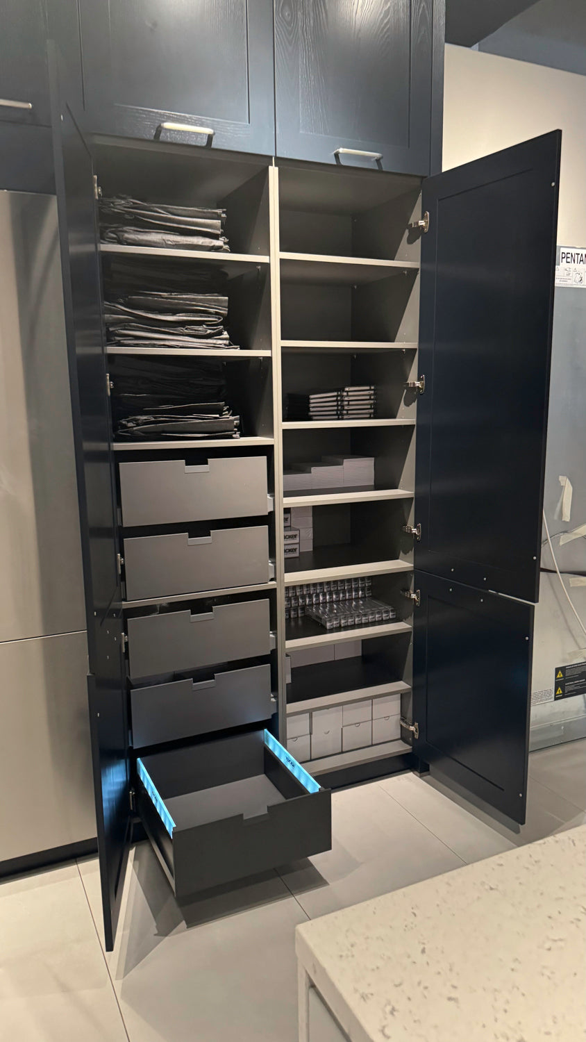 Häcker Velvet Blue & Light Grey Modern Kitchen with Island and Stone Countertops